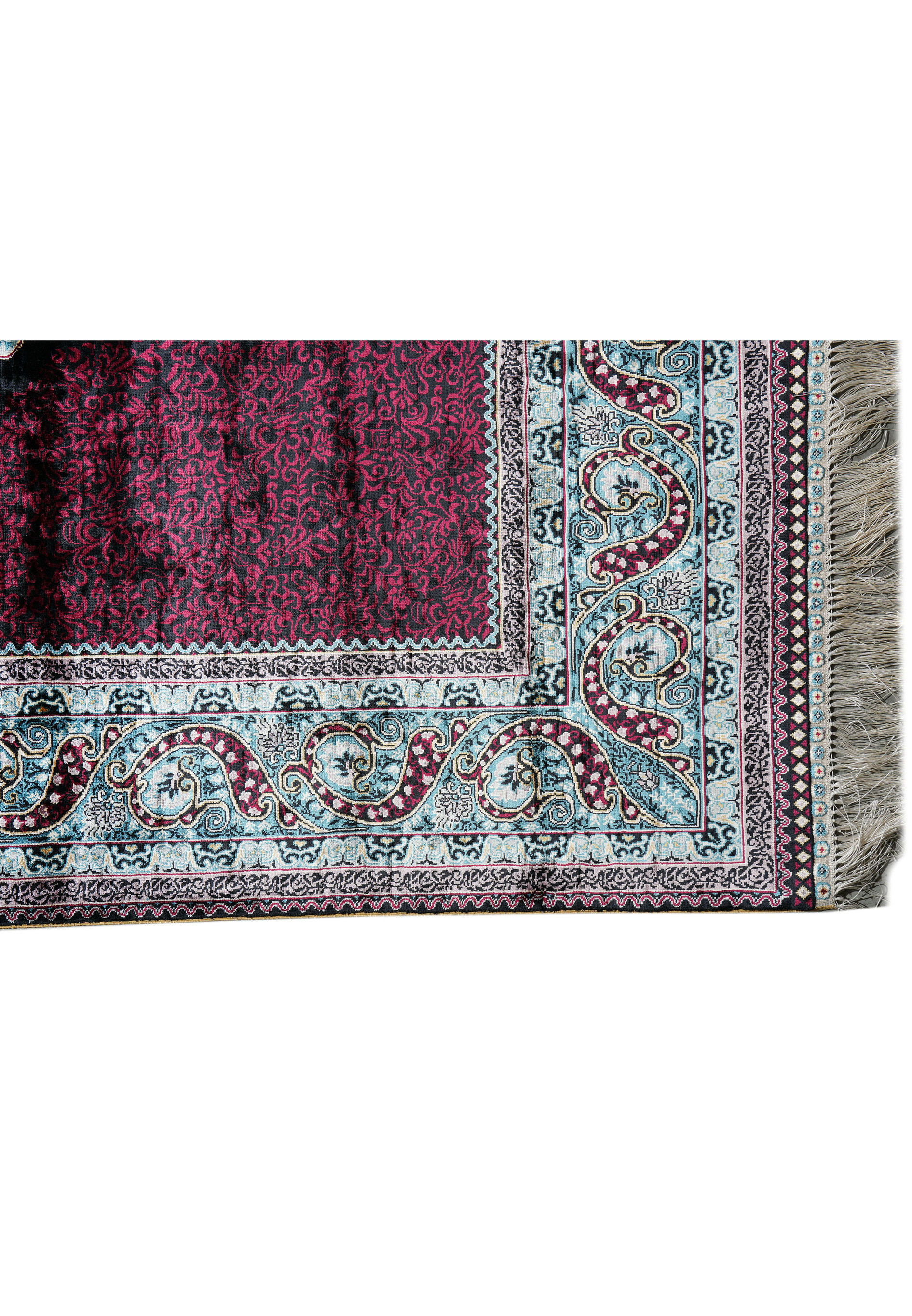 Rolled silk oriental rug with burgundy and sky-blue tones highlighting sheen and texture