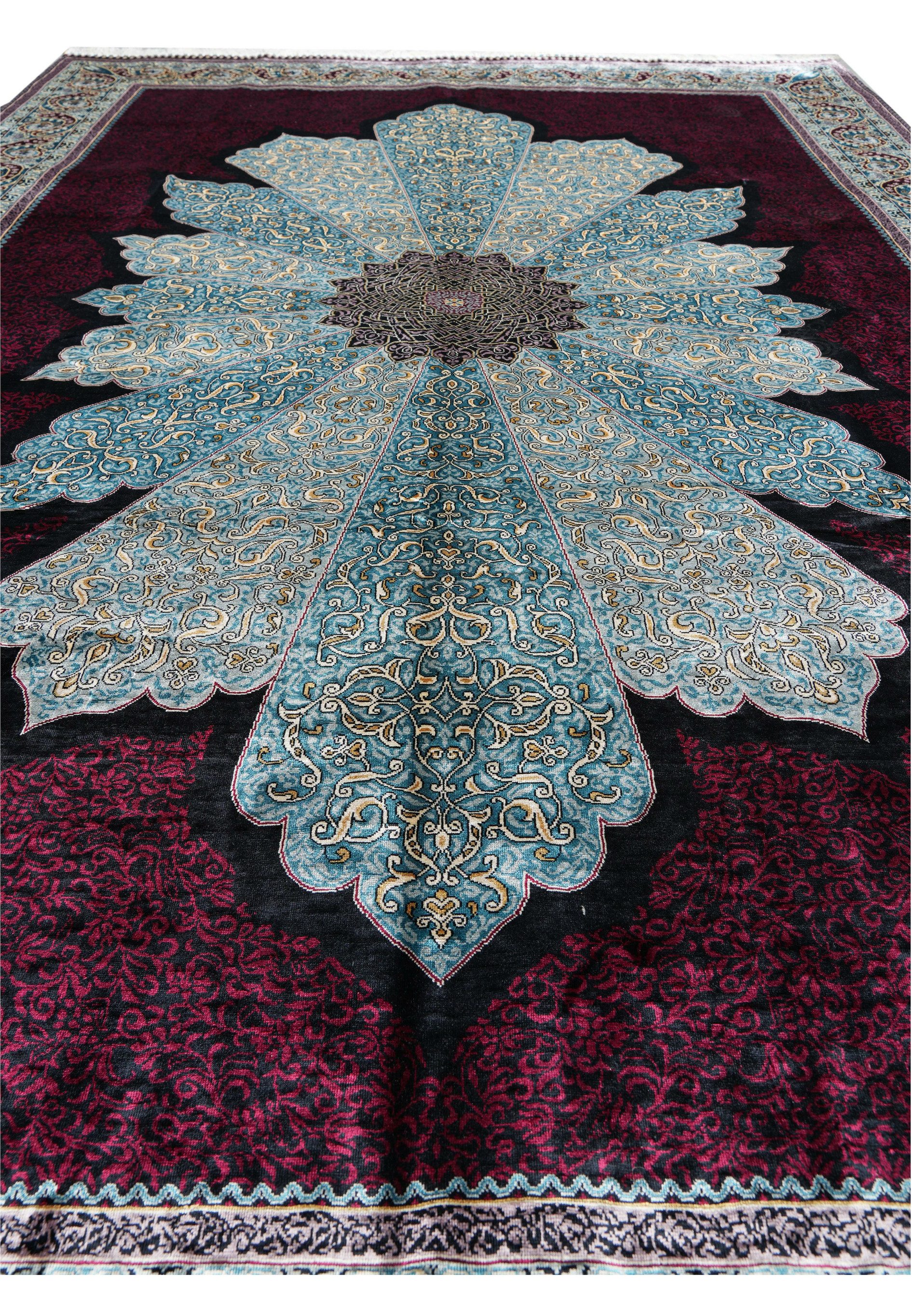Detailed silk weave pattern showing blue, gold, and ivory arabesques on the Chinese oriental rug