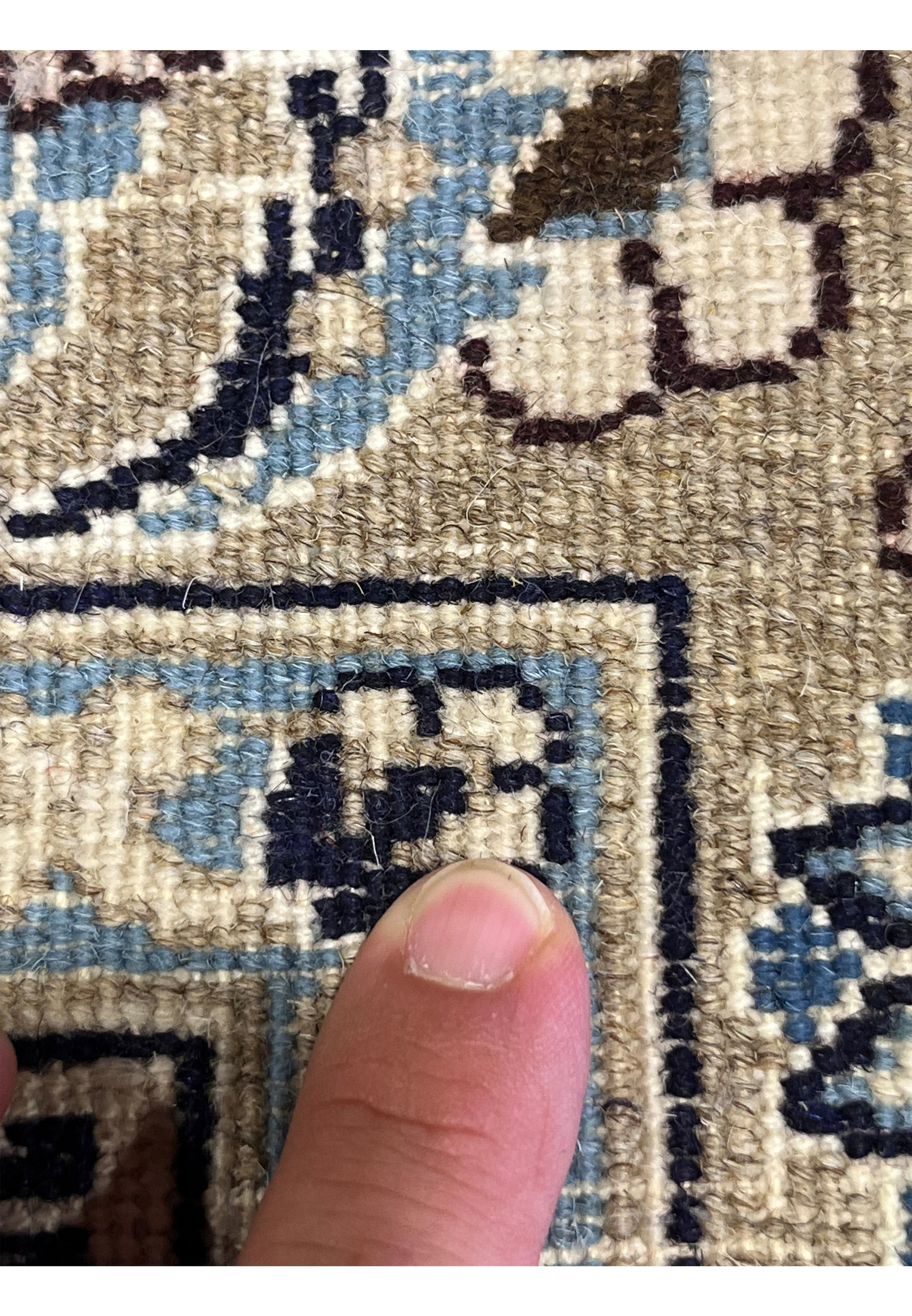Macro of backside weave on Persian Nain 9LA Rug showing knot precision, wool texture, and blue-beige color transitions.