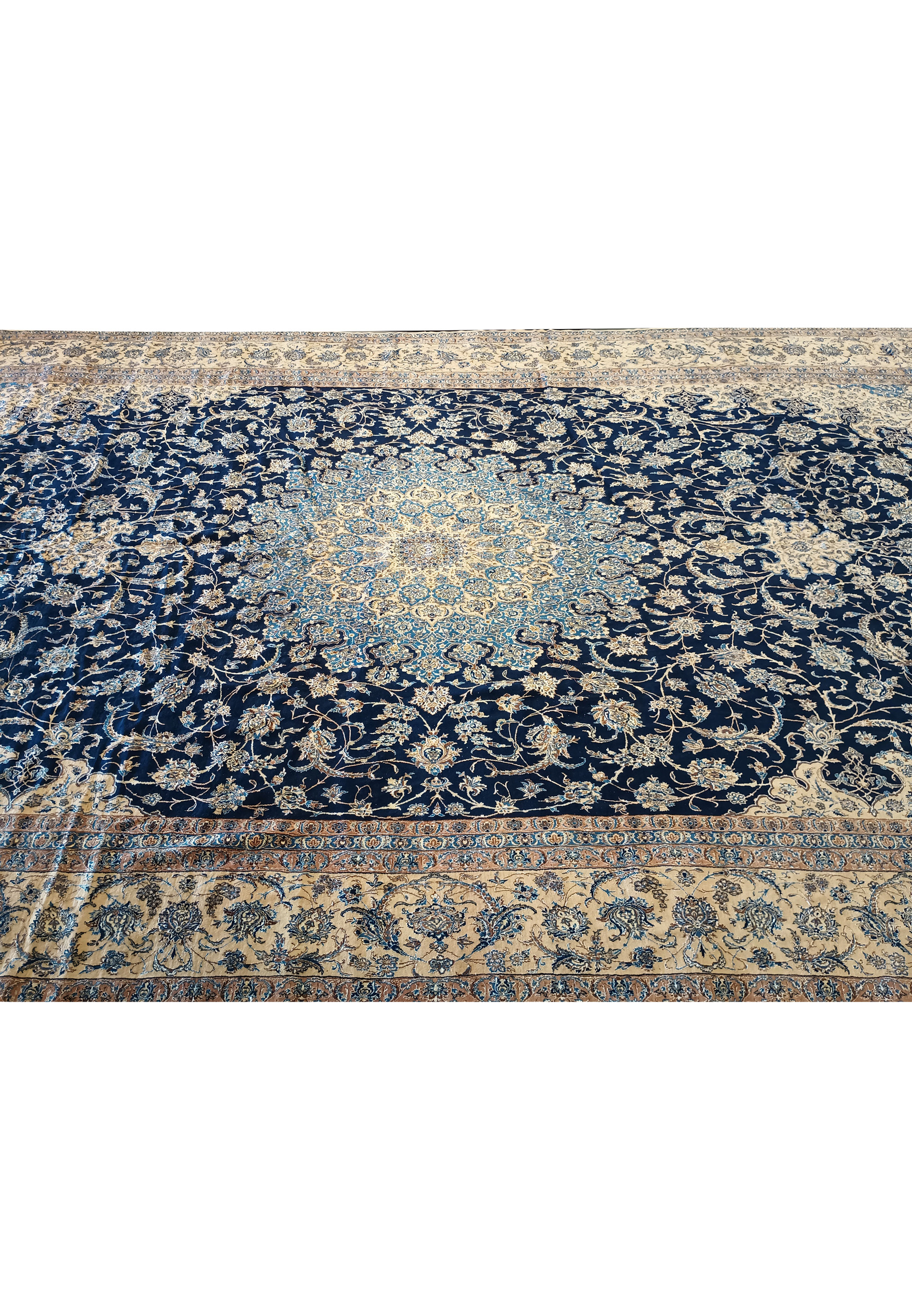 14x25'6 Nain 9 LA Persian rug laid flat with fold lines on navy and ivory floral pattern.