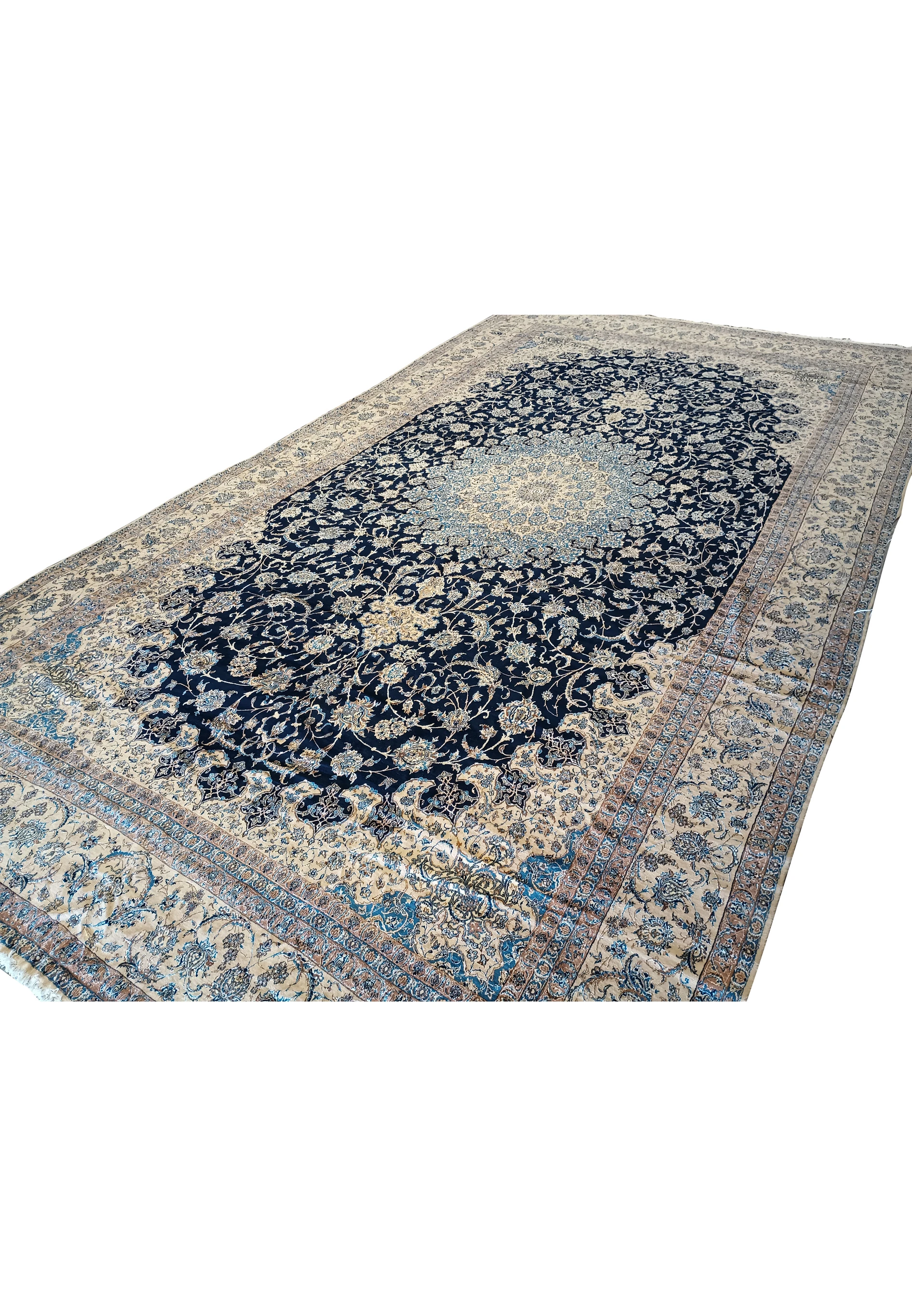 Angled view of 14x25'6 Persian Nain rug displaying floral medallion and detailed borders.