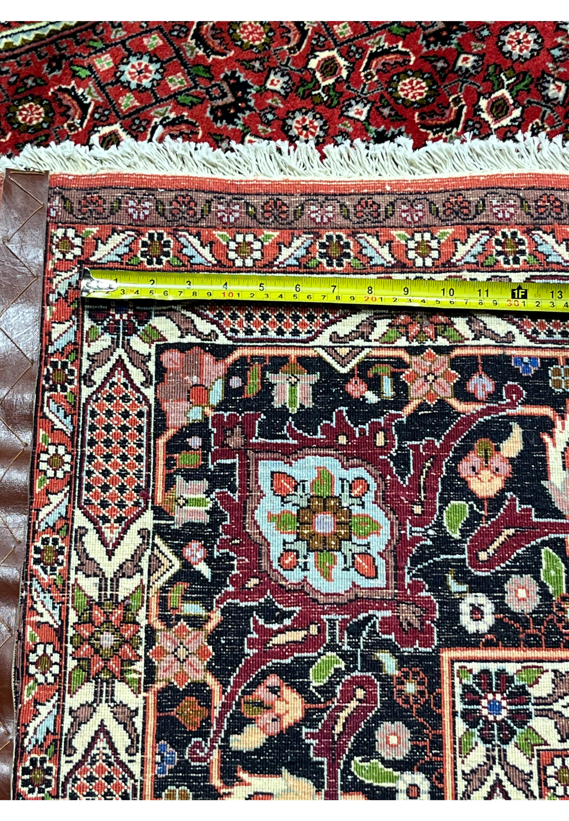 backside of 10x13 Bijar Persian rug with visible hand-knotted structure and dense weave