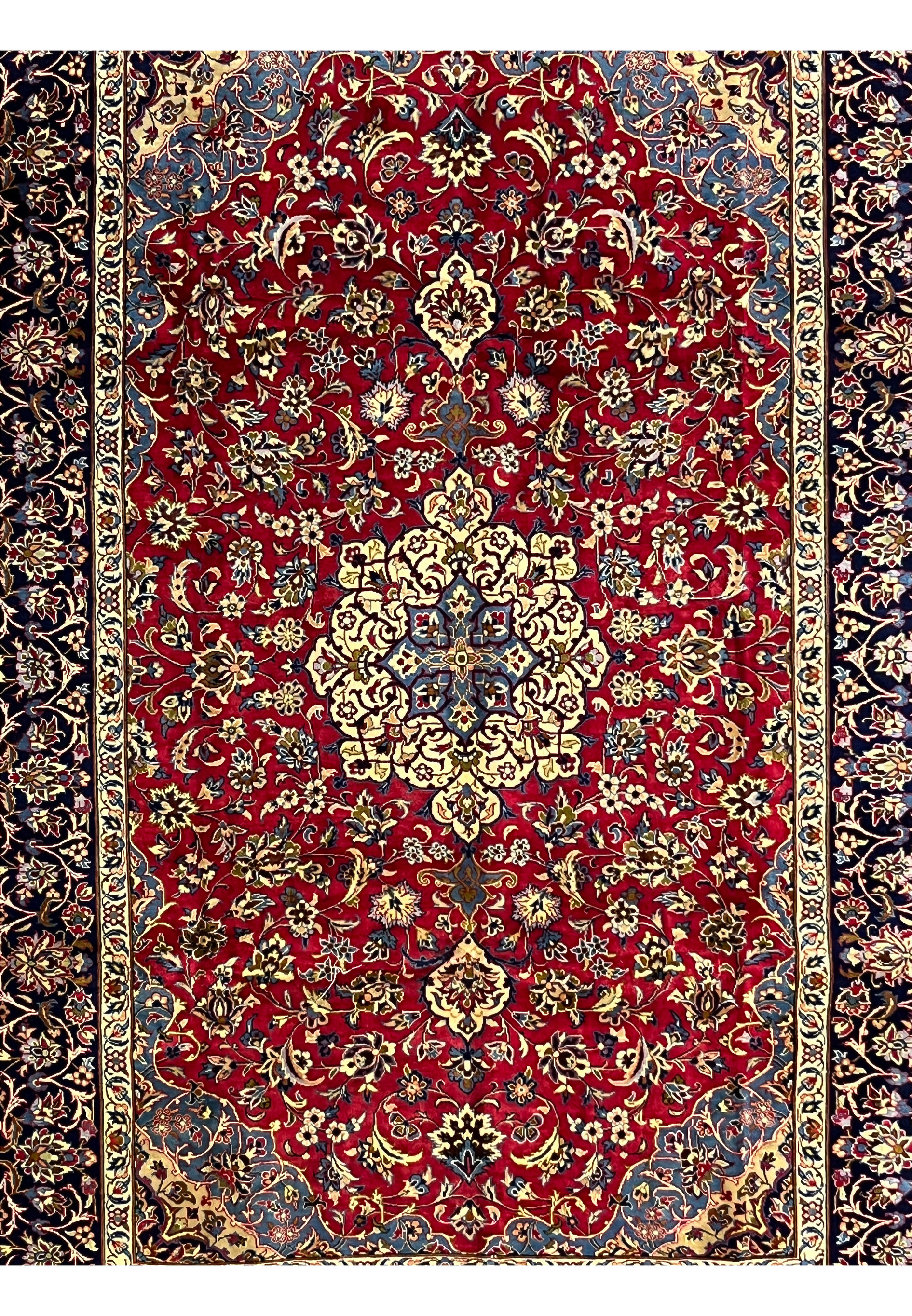 Central field of 8'5 x 11'8 Persian Isfahan rug showing red wool background and floral medallion symmetry.