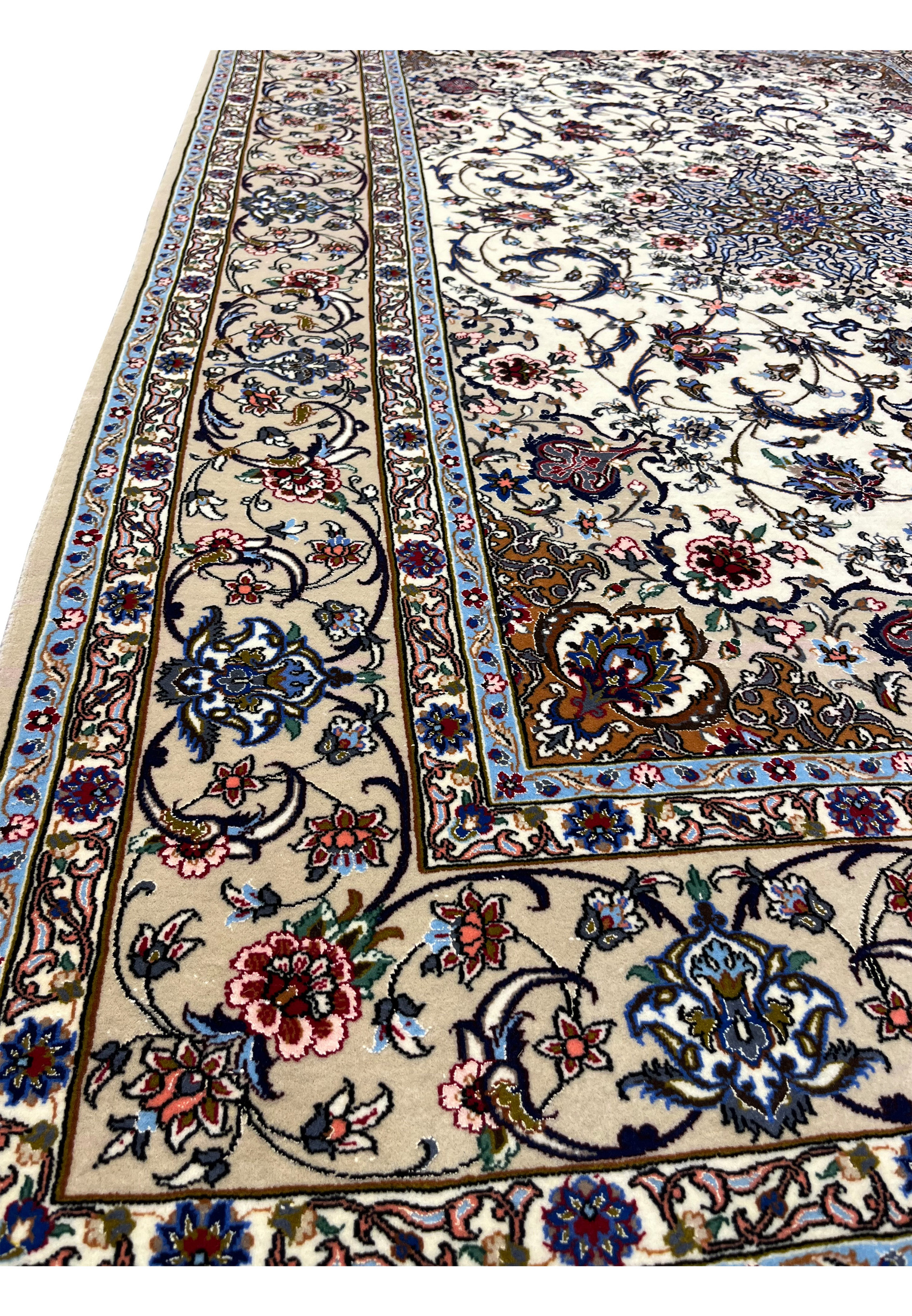 Side view revealing rug texture, silk highlights, and dense floral motifs on ivory background.