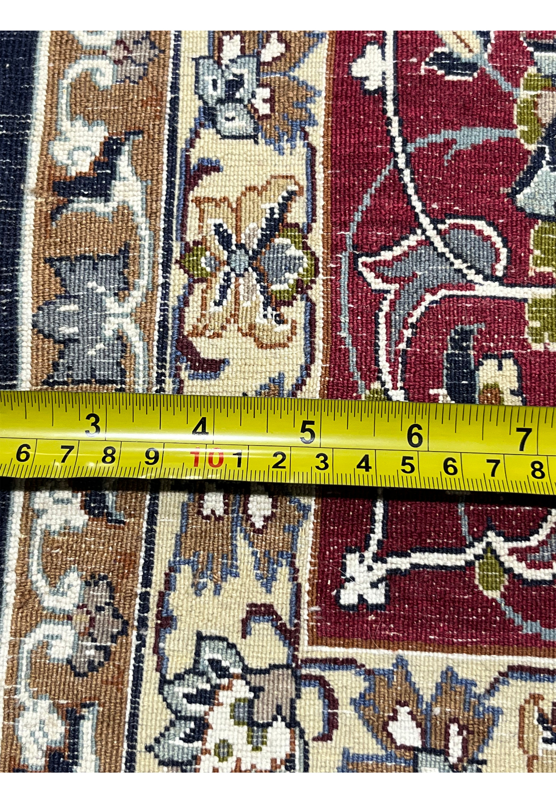Backside close-up showing knot density, crisp pattern definition, and craftsmanship quality of the 7x11 Persian Isfahan rug.