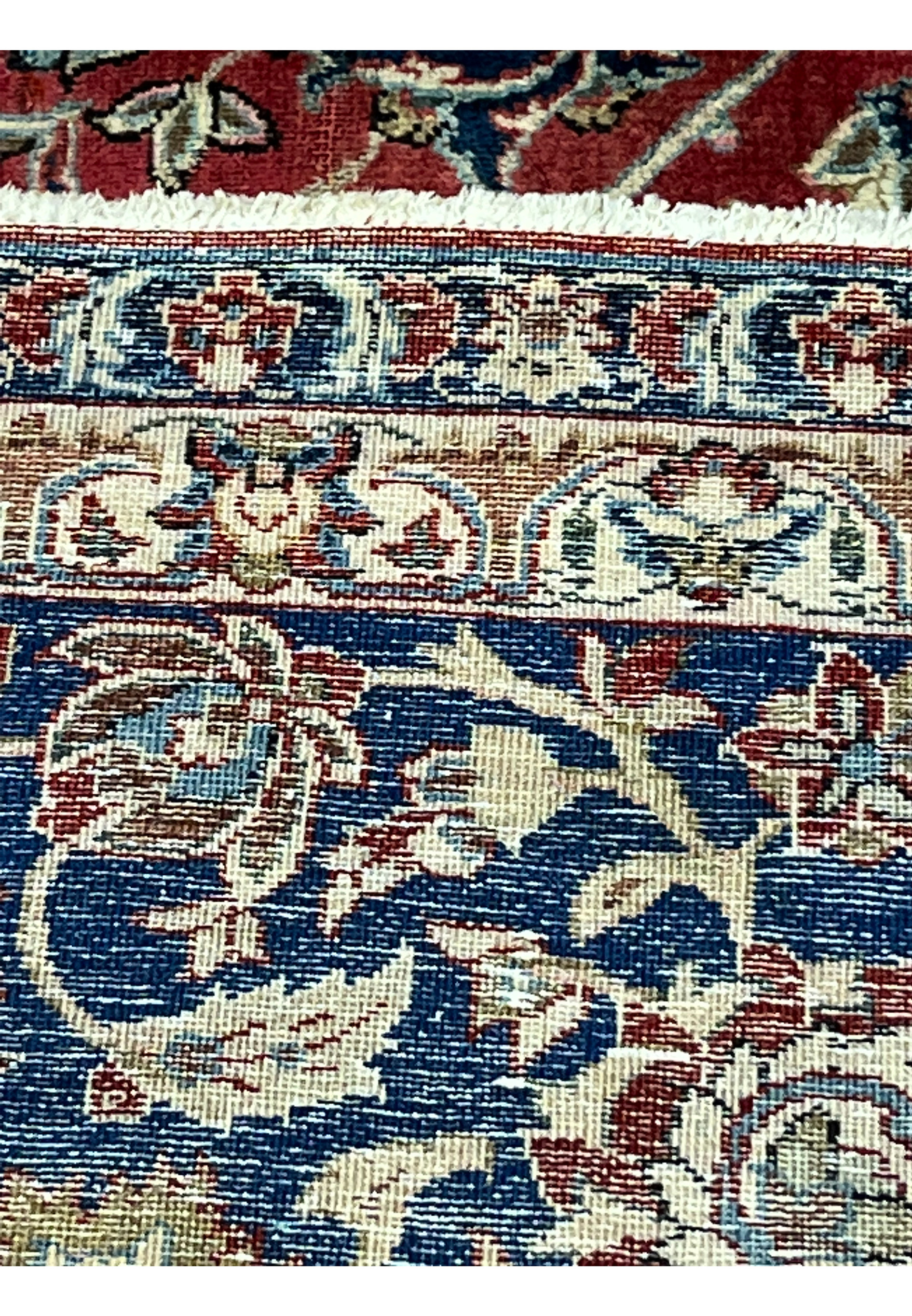Backside view of a vintage Najafabad Persian rug highlighting hand-knotted construction and tight weave design.