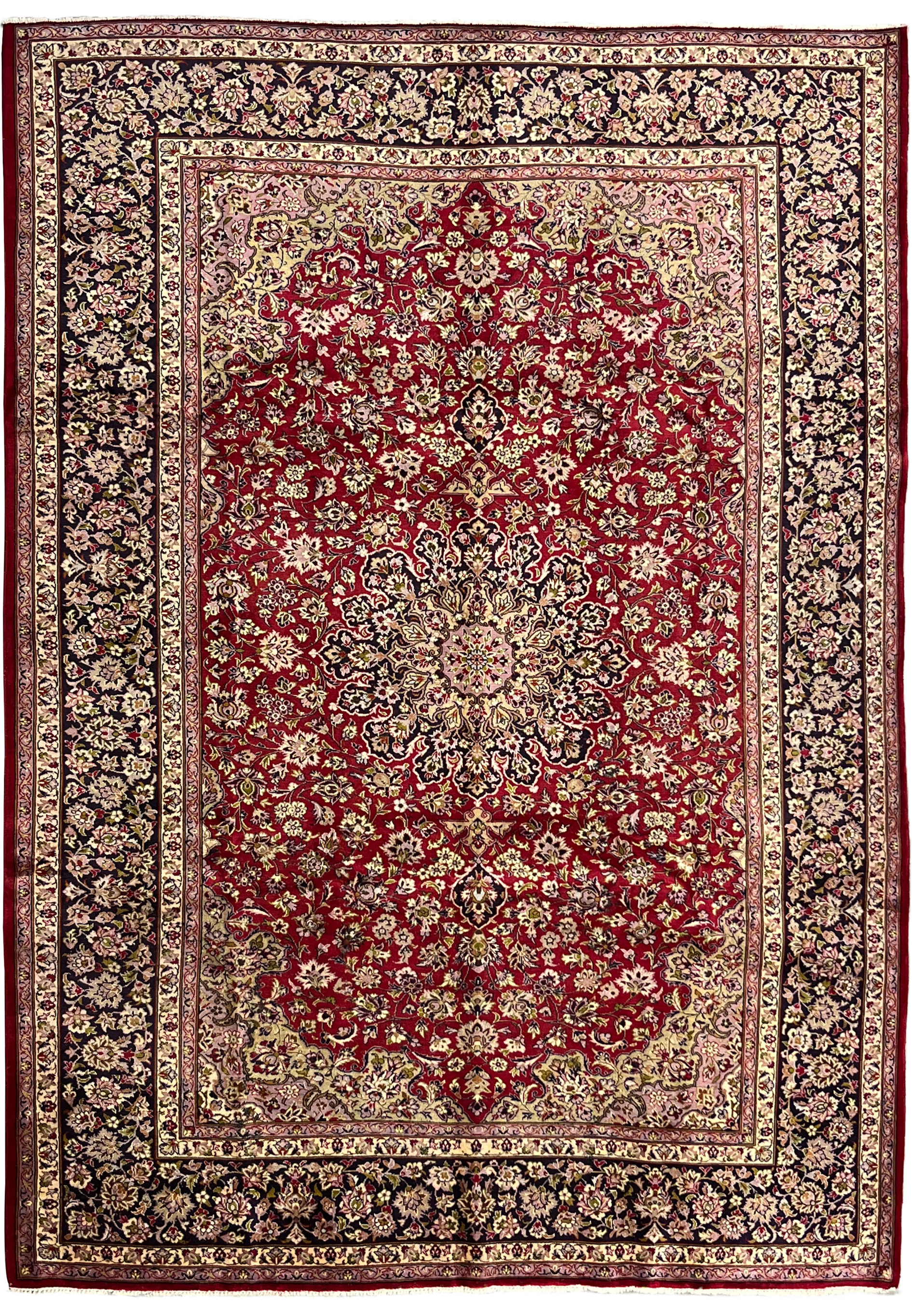 Full view of 9'8 x 13'10 red Persian Isfahan rug with floral medallion and navy borde
