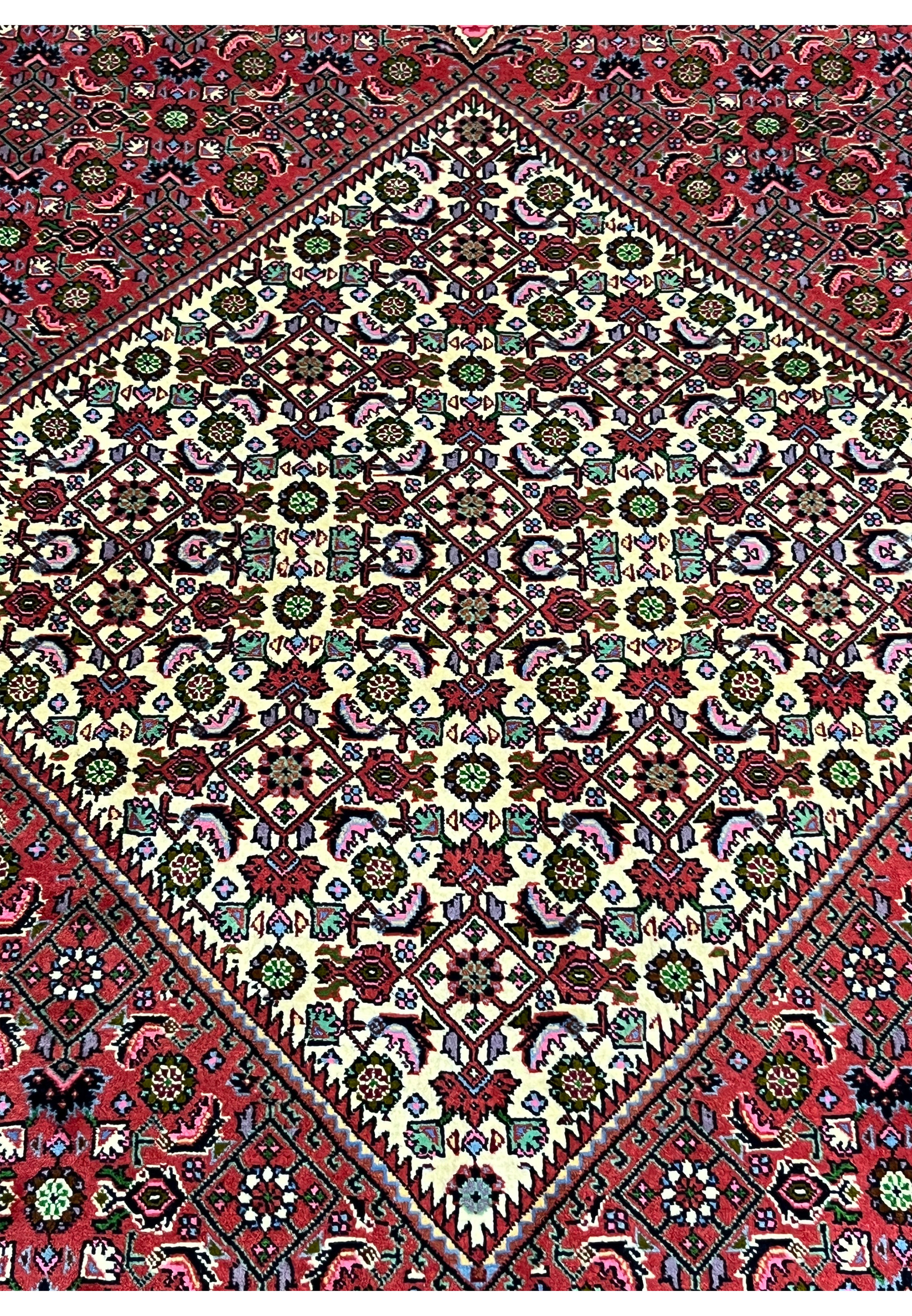 Medallion close-up of Persian Bijar rug revealing ultra-fine knot density, layered floral geometry, and powerful iron wool texture