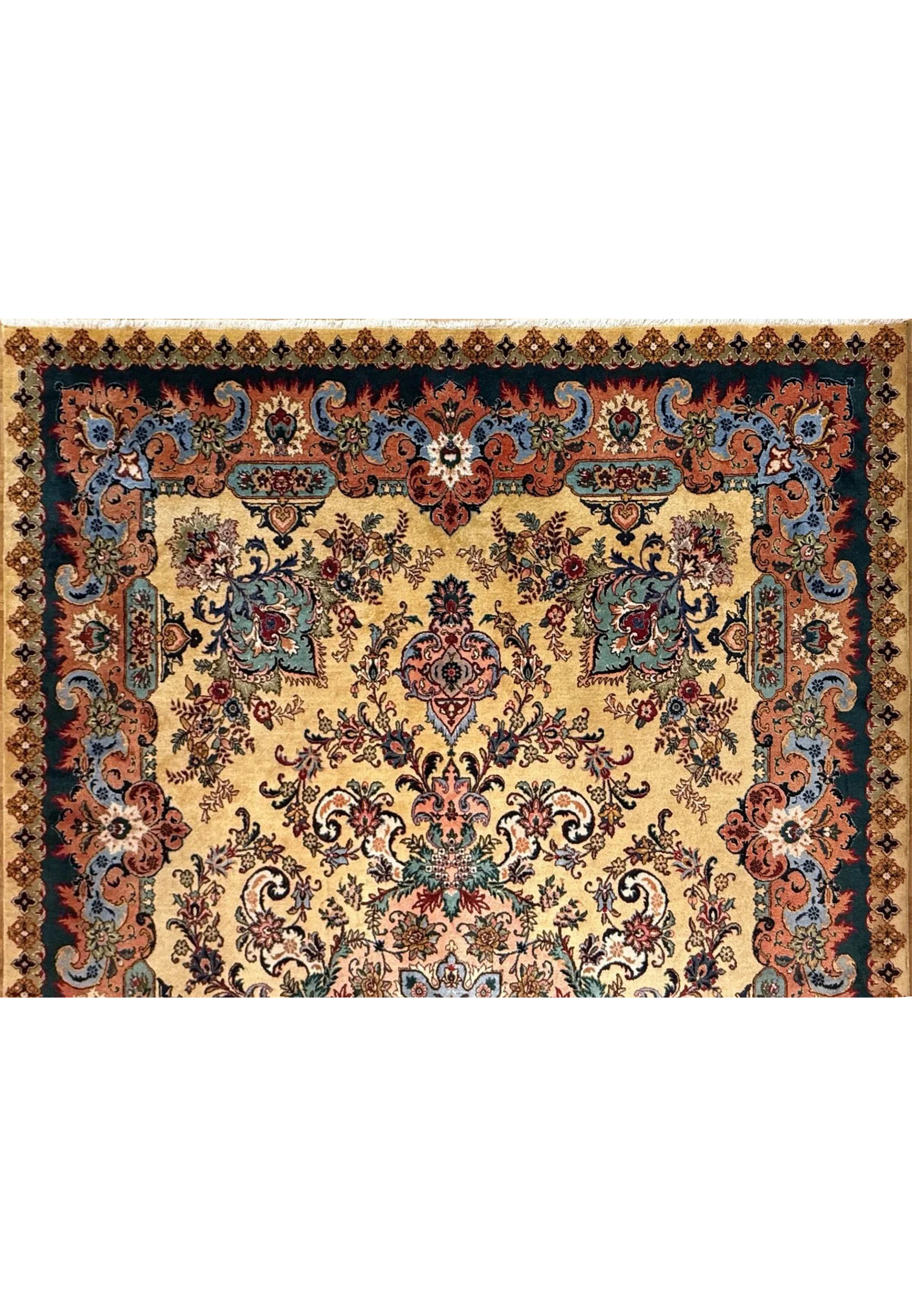 Upper section of Persian Tabriz rug showing floral cartouches in coral, teal and slate blue tones