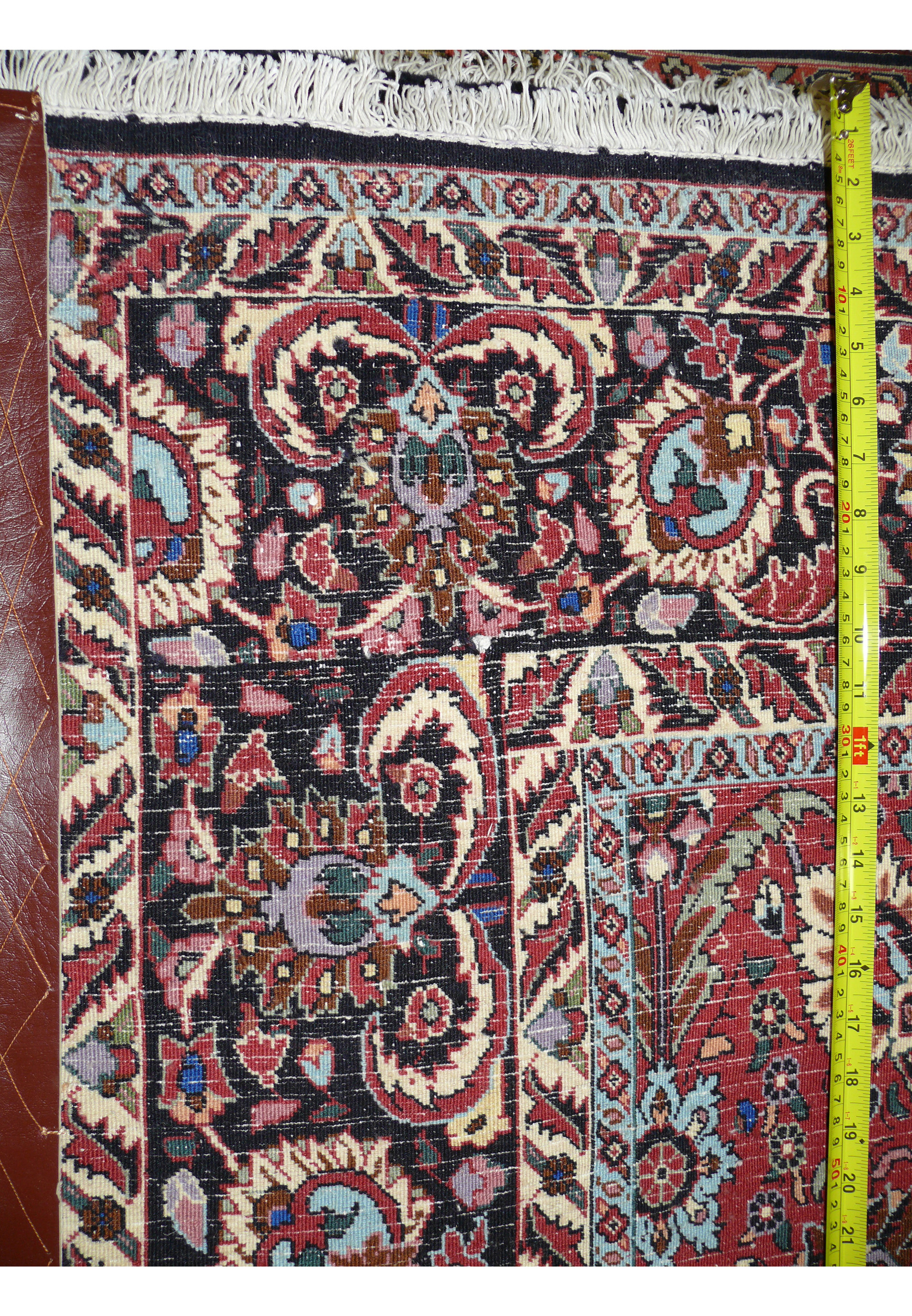 Backside view of a hand knotted 6'6 x 9'6 Persian Bijar iron rug showing dense weave and cotton foundation