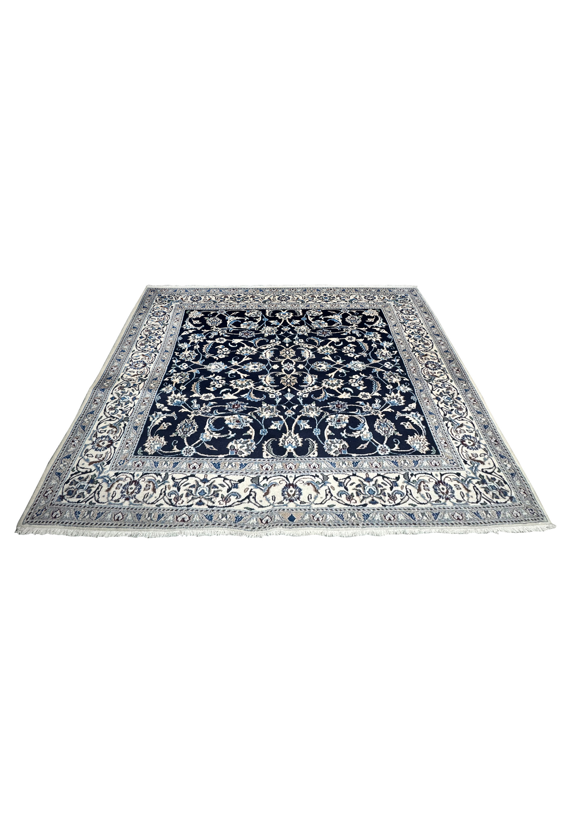 Hand knotted square Persian Nain rug laid flat showing balanced floral symmetry and rich navy and ivory color contrast
