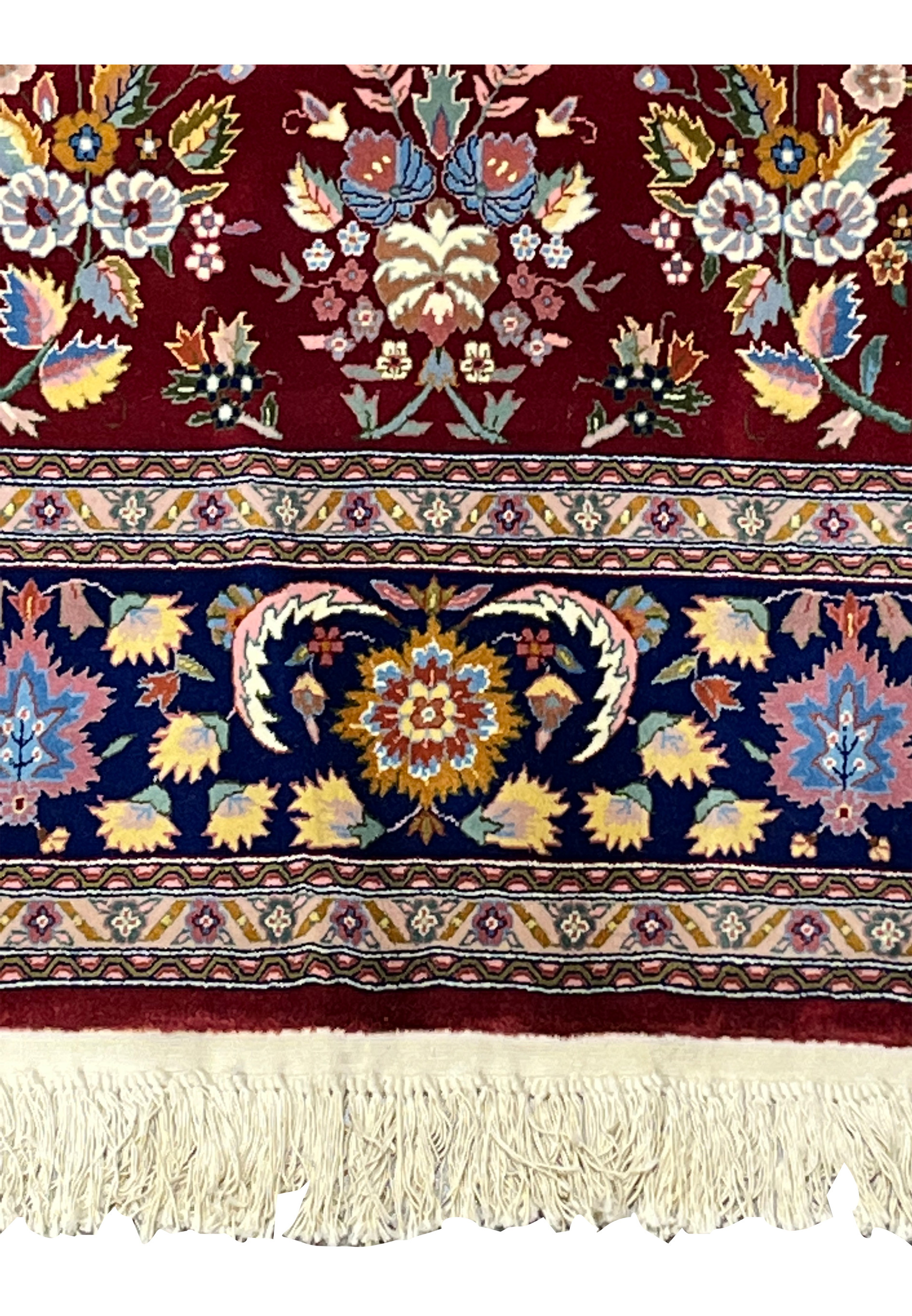 Lower border detail of Persian Isfahan rug with layered guard borders and floral design