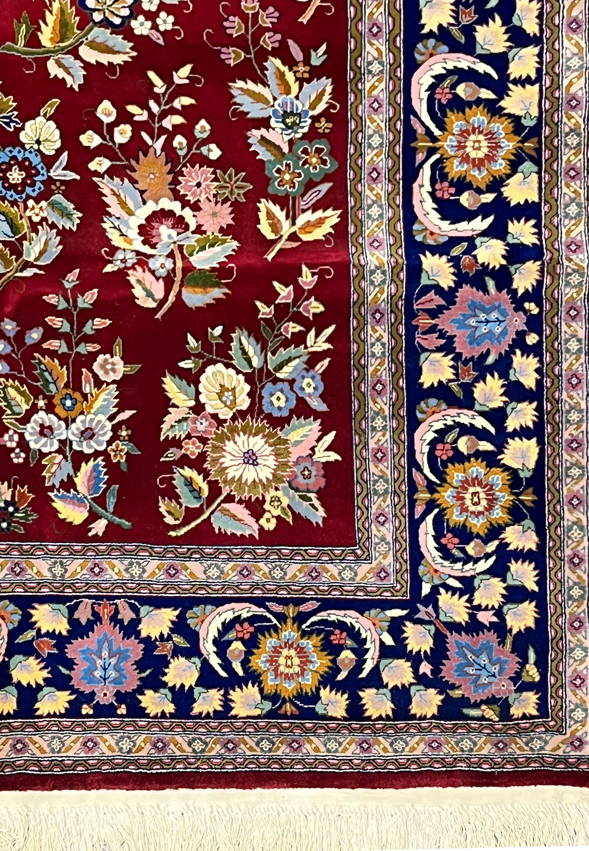 Navy floral border of Persian Isfahan rug with scrolling vines and palmette motifs