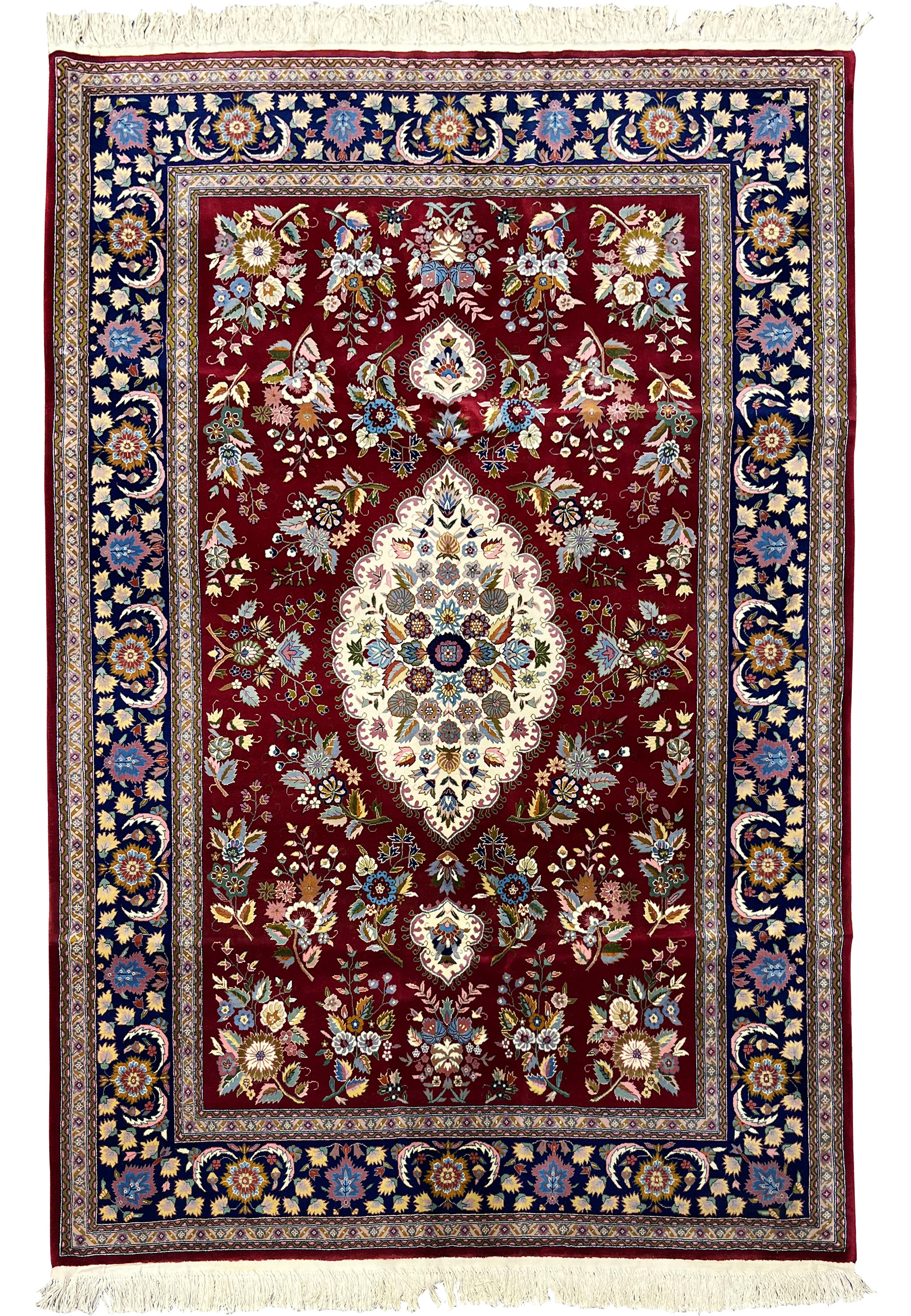 Full view of Persian Isfahan wool and silk rug with burgundy field, ivory medallion, and navy floral border