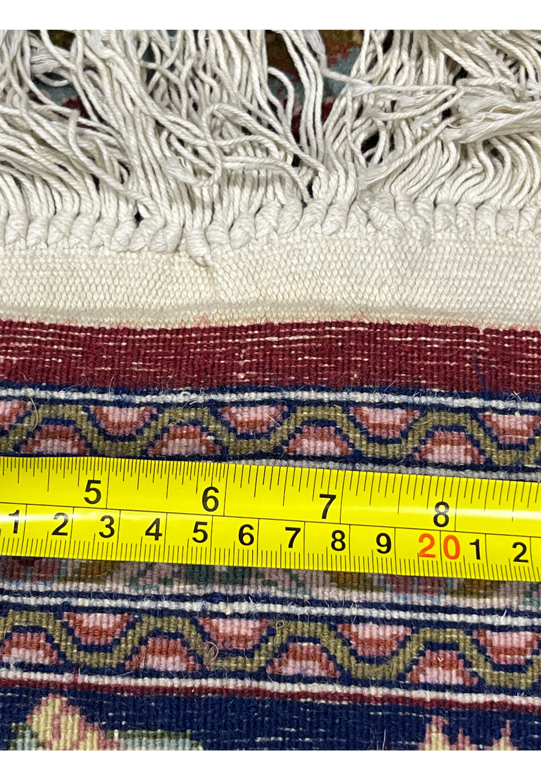 Backside view of Persian Isfahan rug revealing tight weave and fine knot consistency