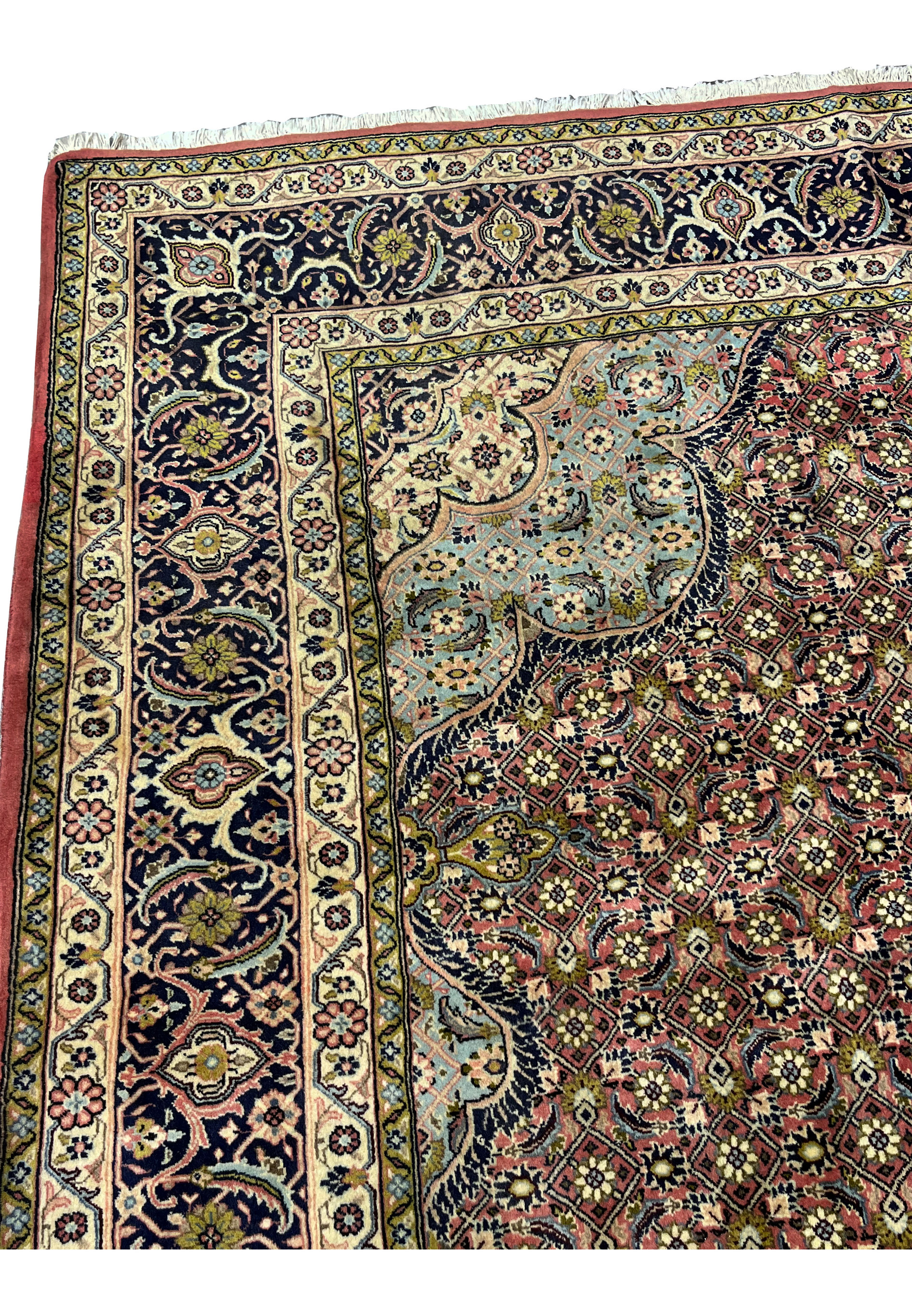 Side view of Persian Bijar iron rug highlighting border structure and heavy construction