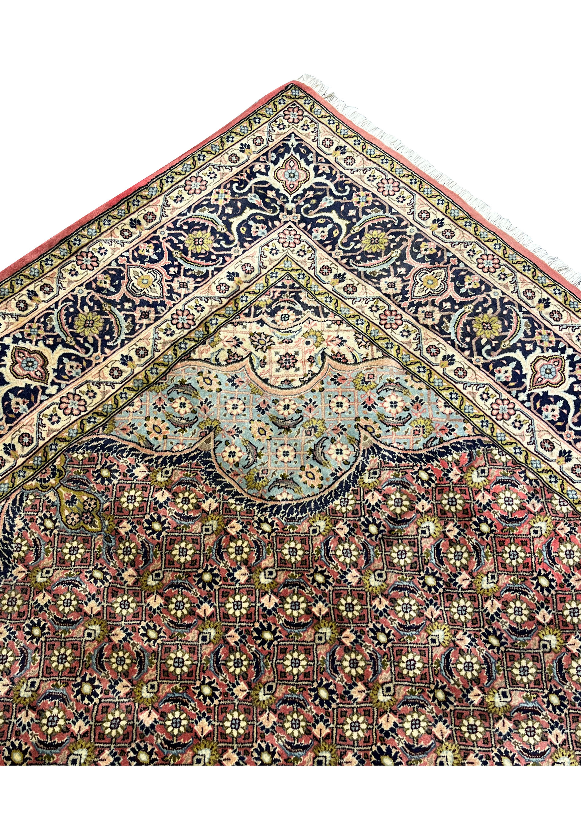 Upper edge detail of Persian Bijar rug showing tight weave, clean finish, and color clarity