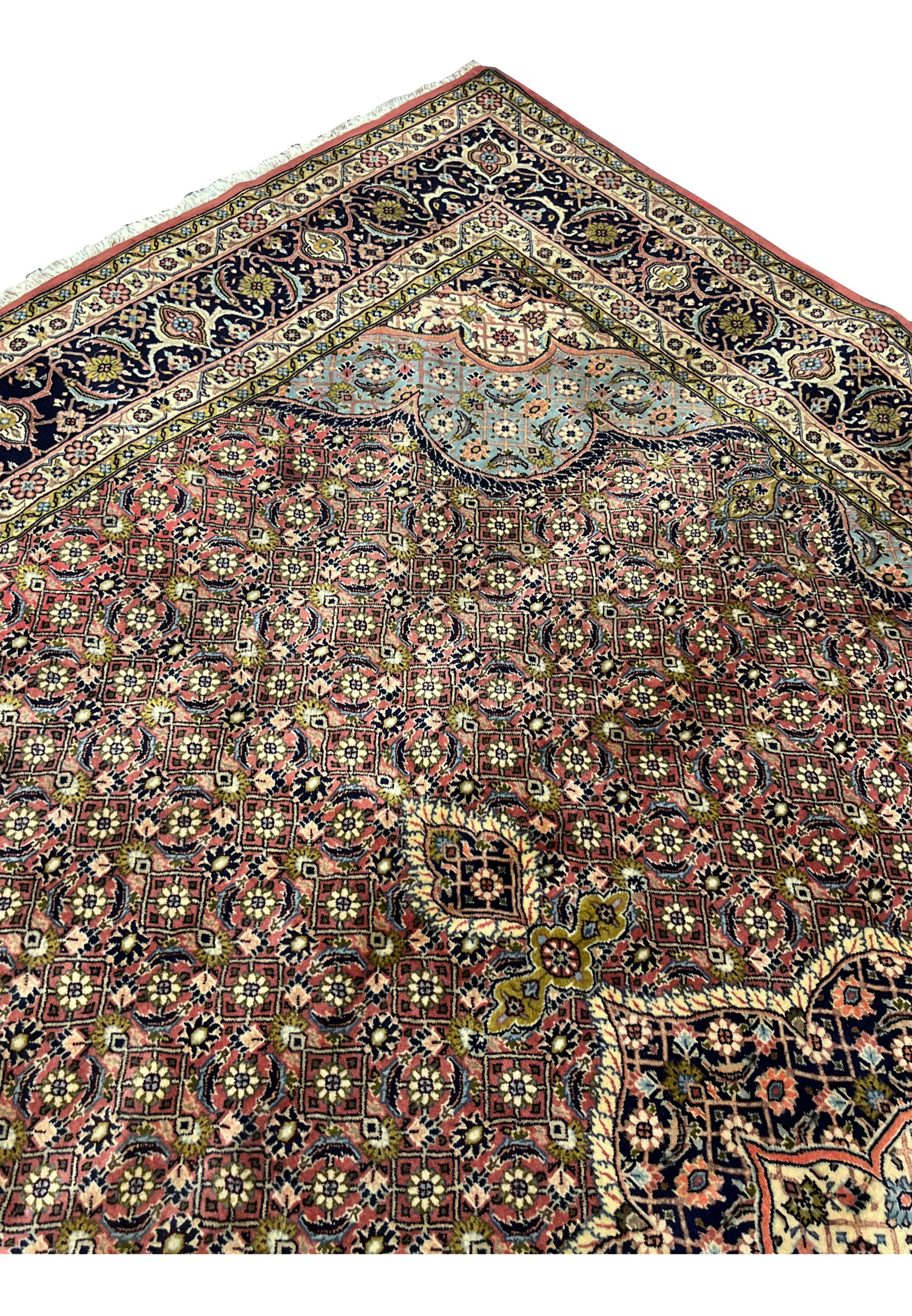 Upper field view of Persian Bijar iron rug showing repeating rosettes and structured layout