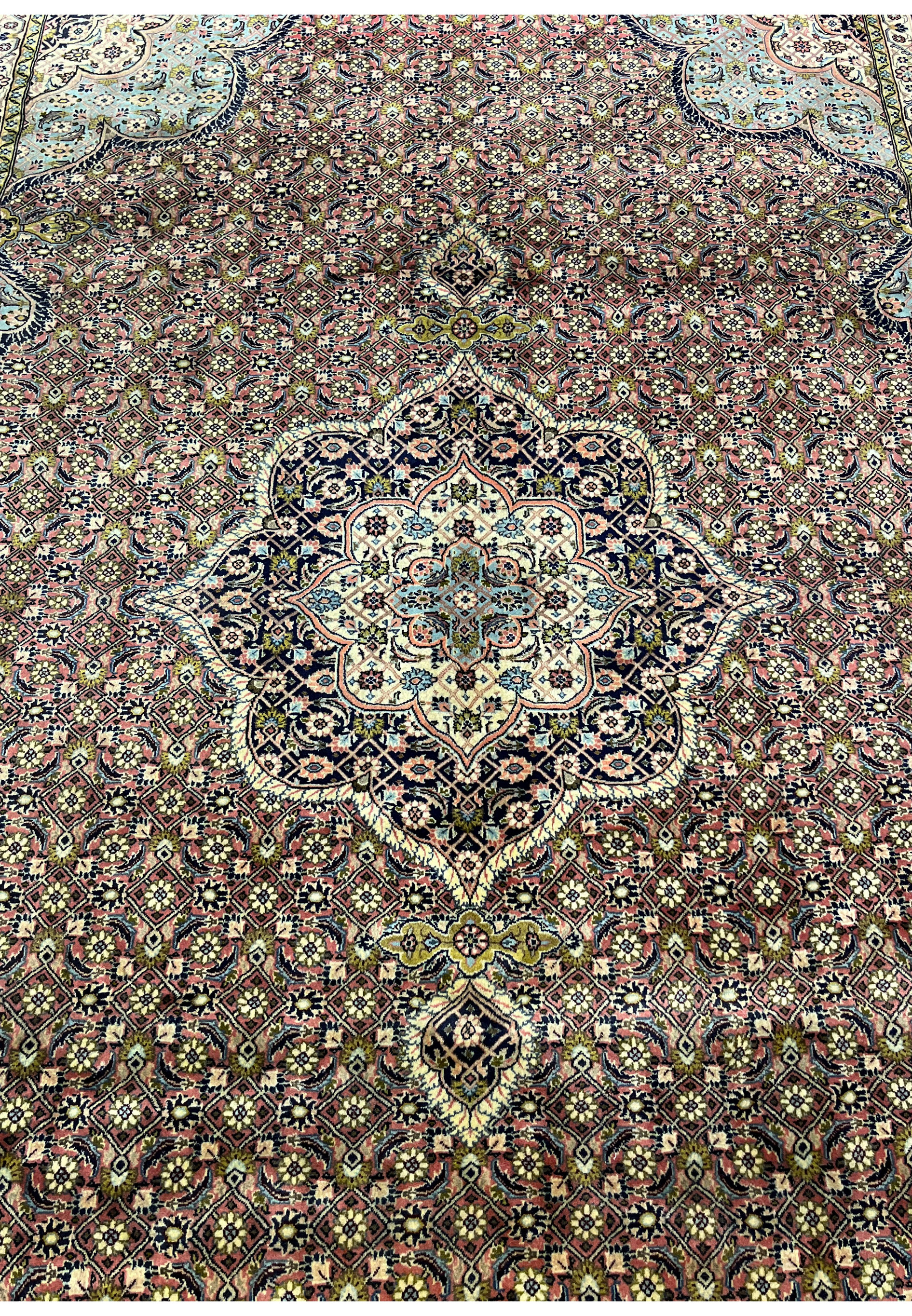 Central medallion view of Persian Bijar rug with layered geometric and floral detailing