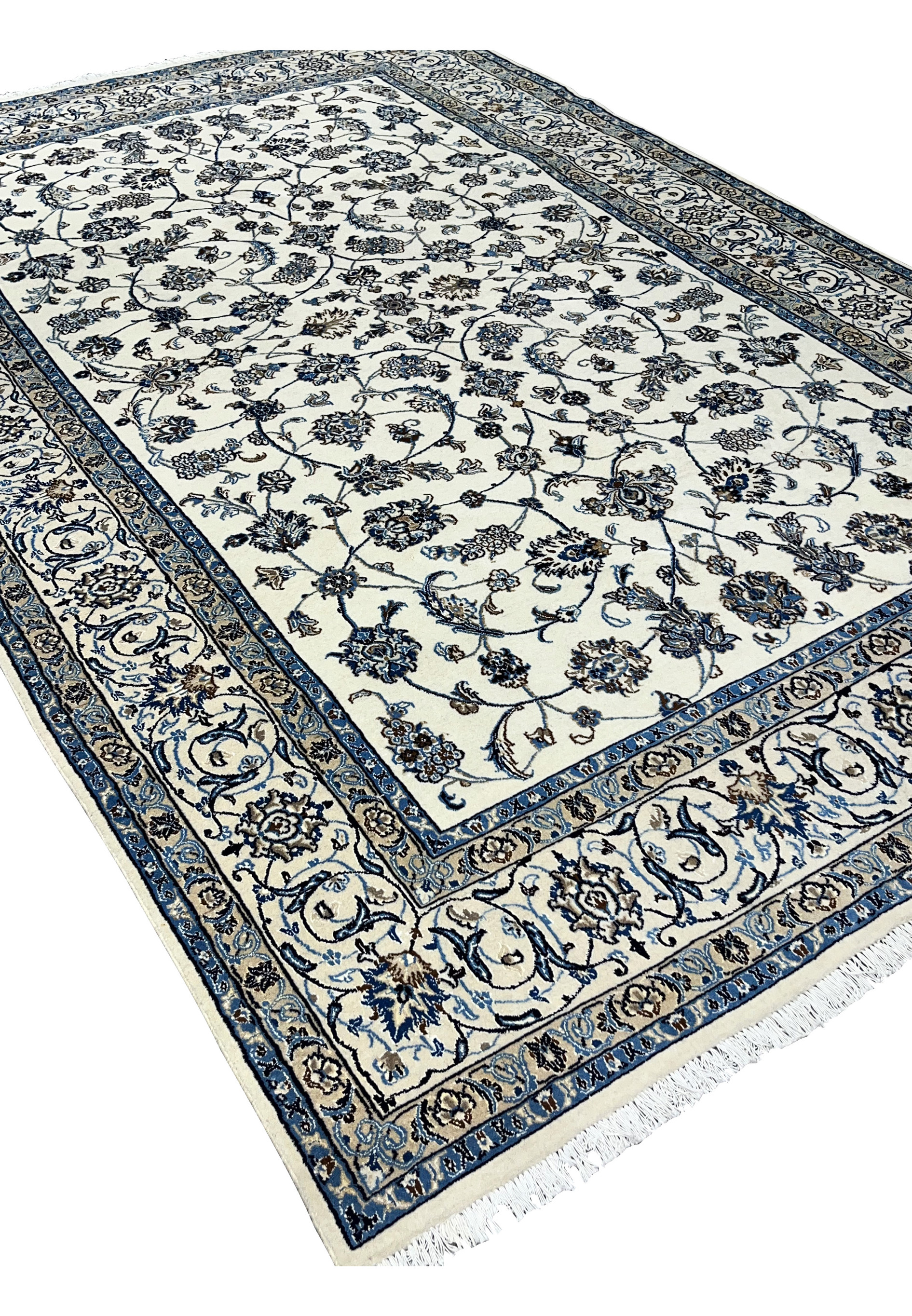 Angled perspective view of Persian Nain 9 LA rug showing pile texture and design depth