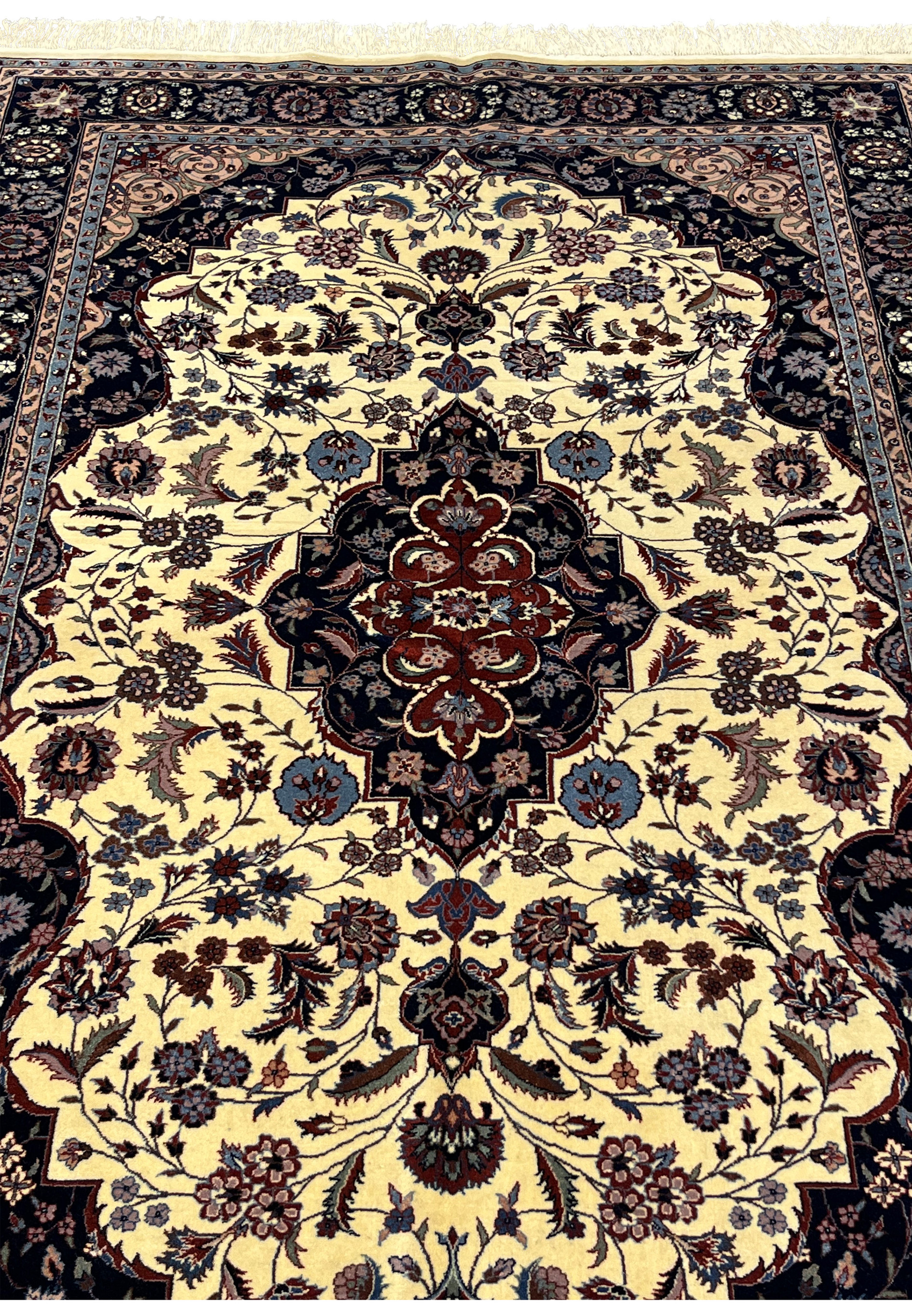 Midfield detail of Persian Tabriz rug showing floral vines around the central medallion