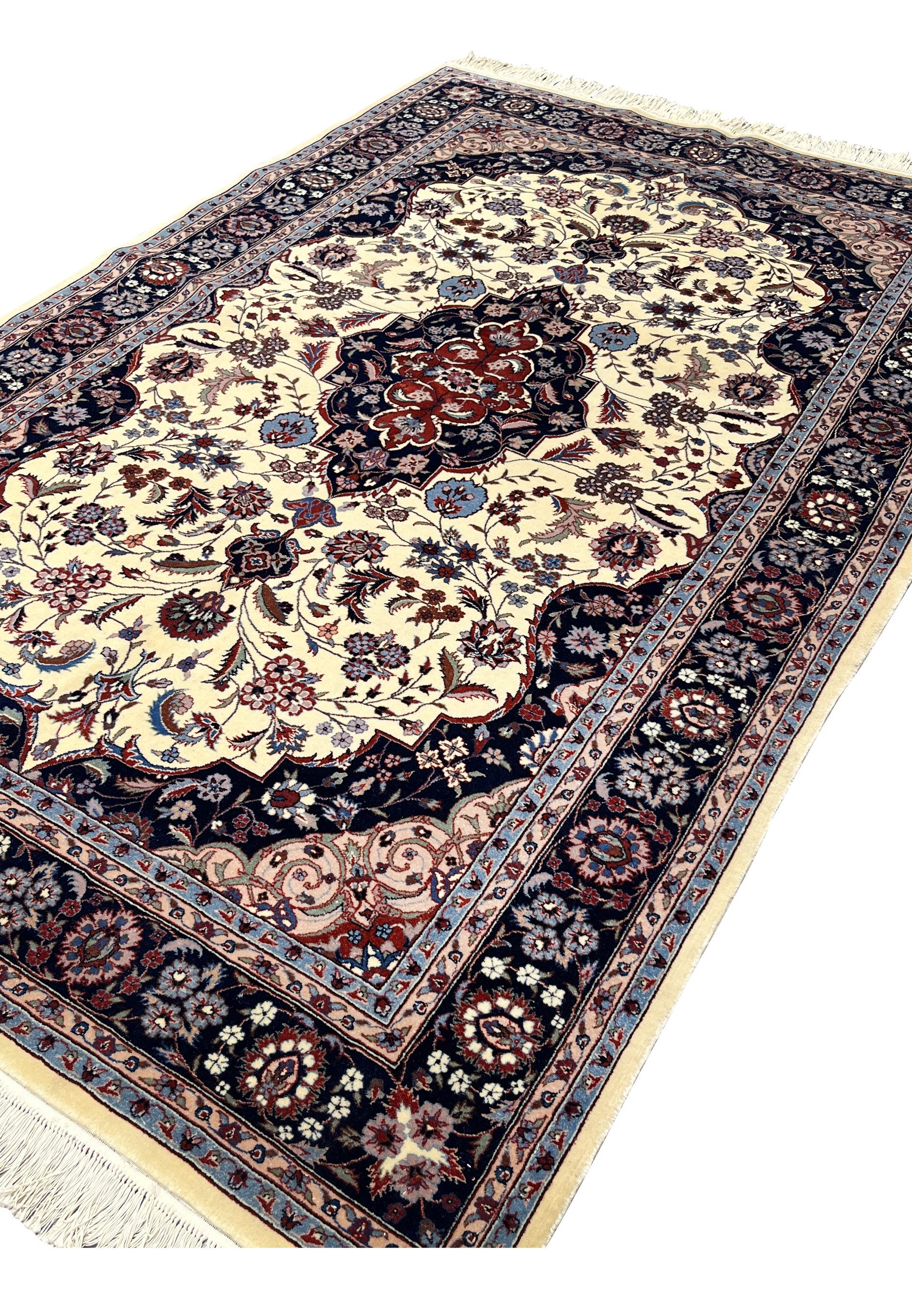 Angled view of 5x8 Persian Tabriz rug revealing pile texture, depth, and color contrast