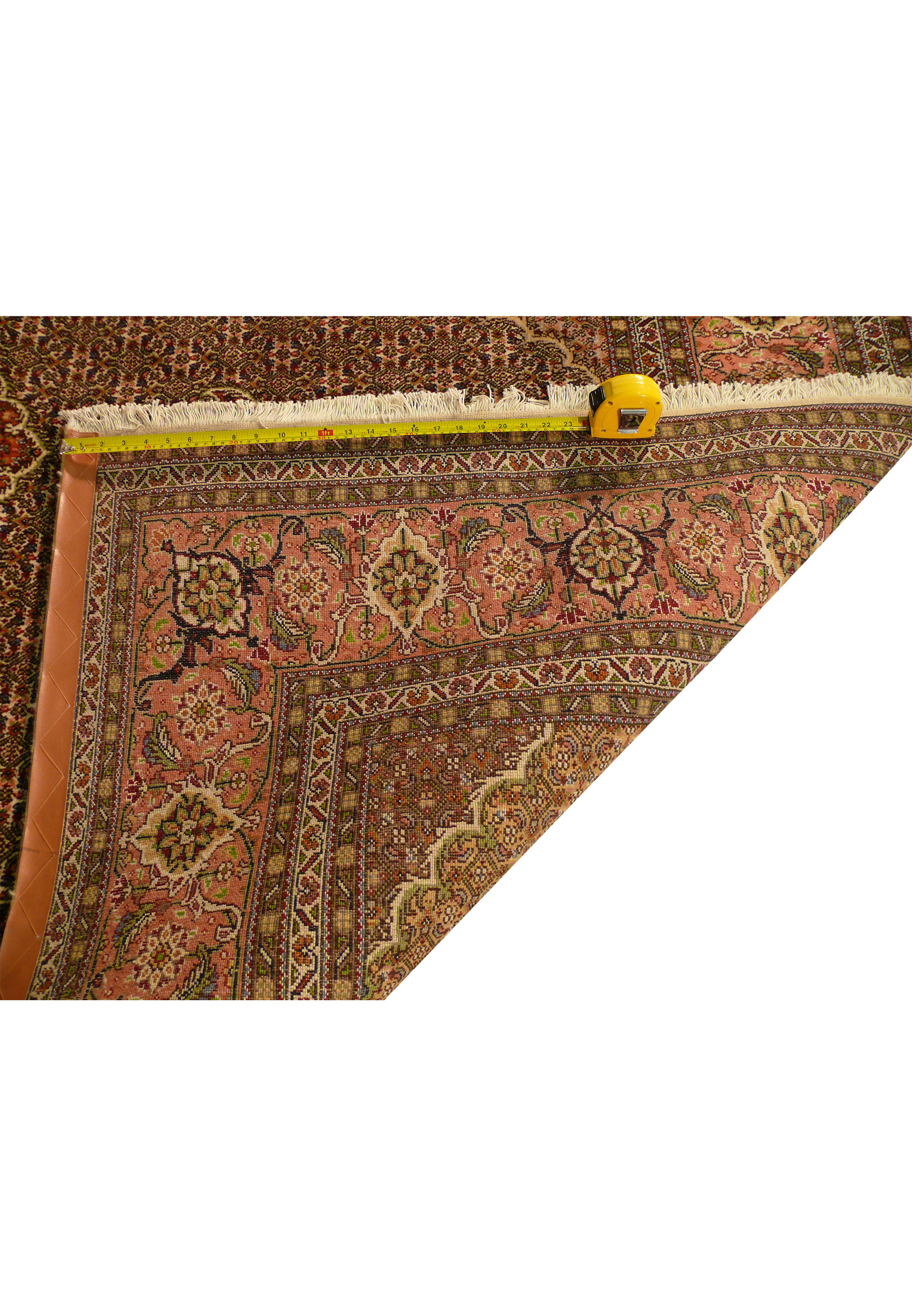 Backside of handwoven Persian Tabriz Mahi rug showing tight knot structure