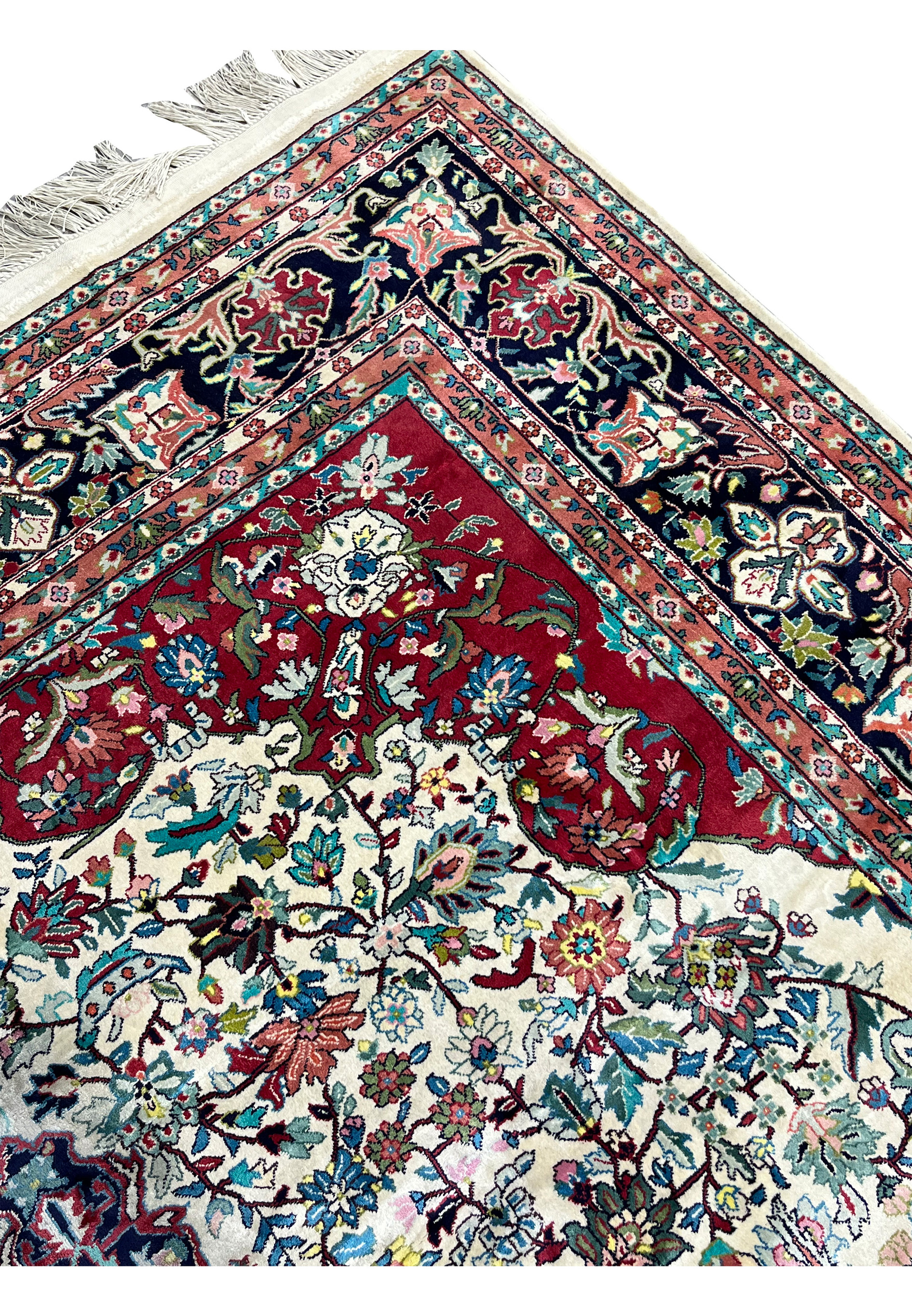 Upper edge and border detail of ivory silk oriental rug