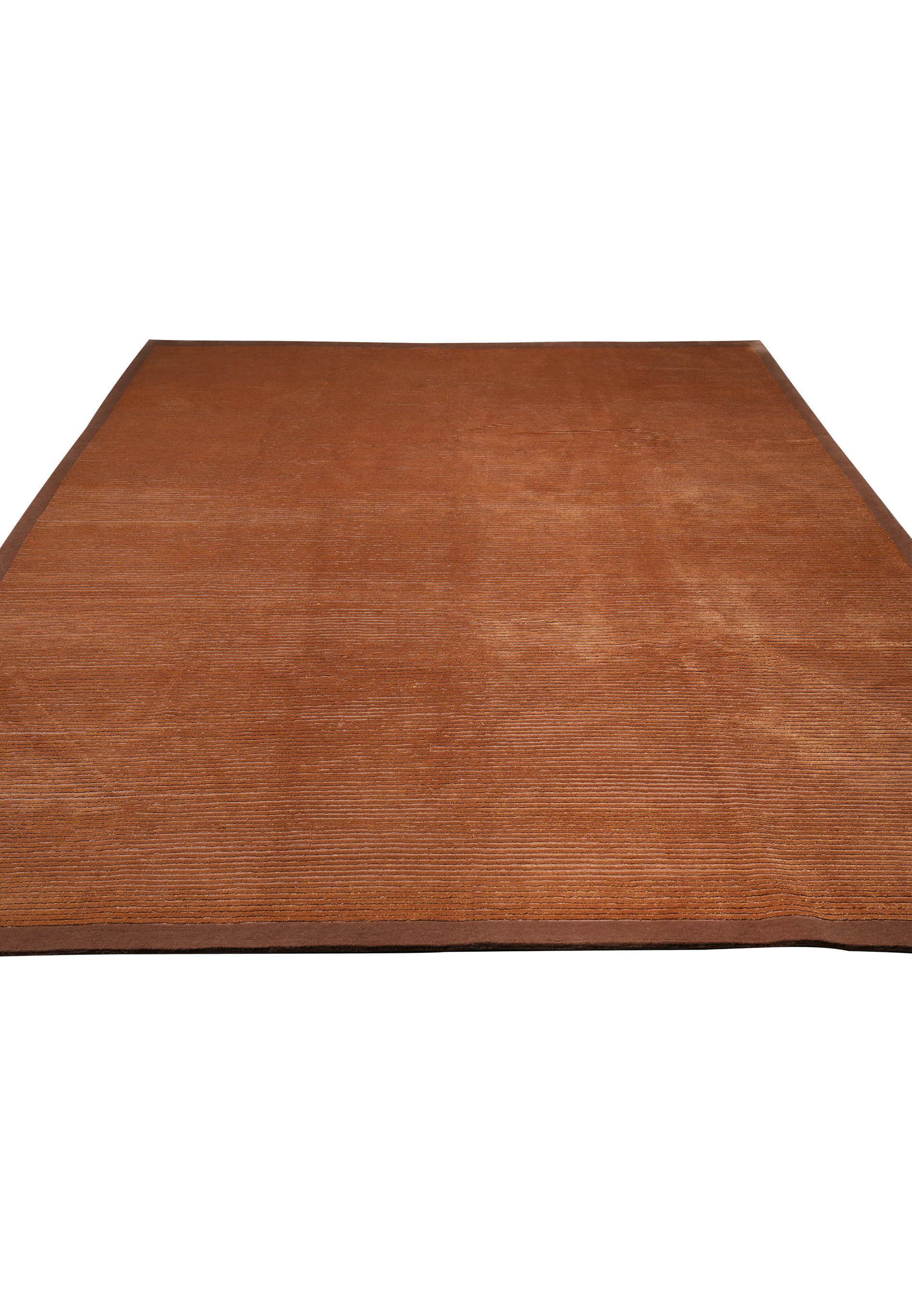 Laid-down view of a modern wool and silk Tibetan rug displaying soft surface texture, tonal depth, and elegant minimalist design