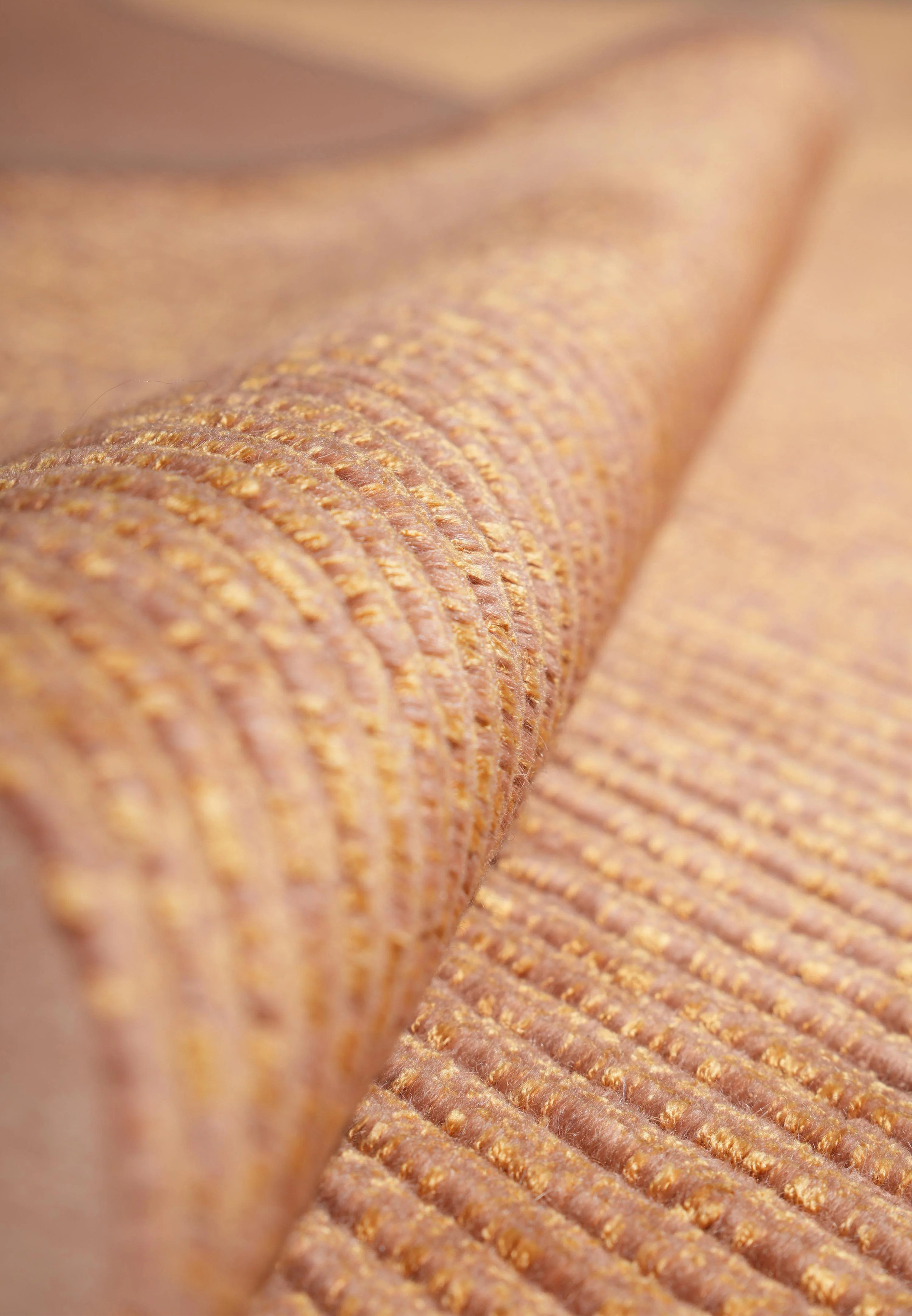 Rolled texture close-up revealing the ribbed weave and shimmering silk fibers that give this modern Tibetan rug its luminous appearance