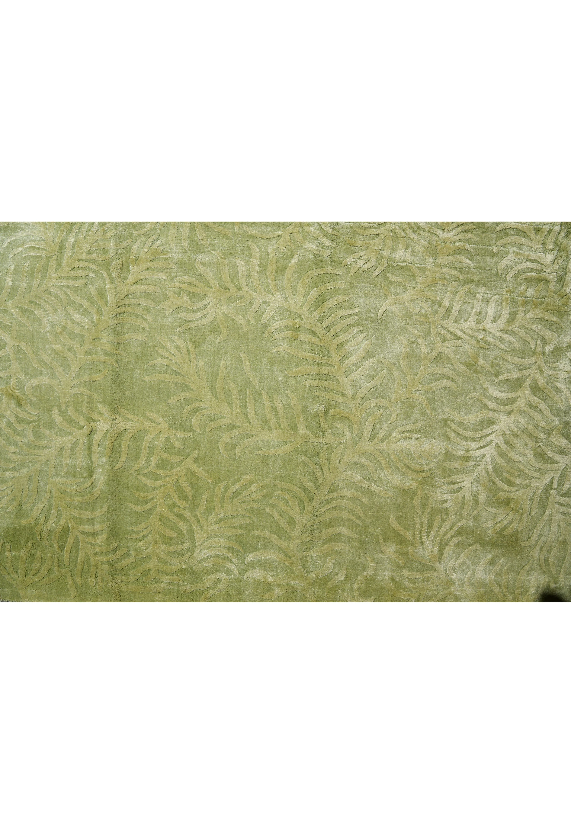 Close-up detail highlighting the organic leaf-inspired pattern and raised texture woven into this modern olive green rug.