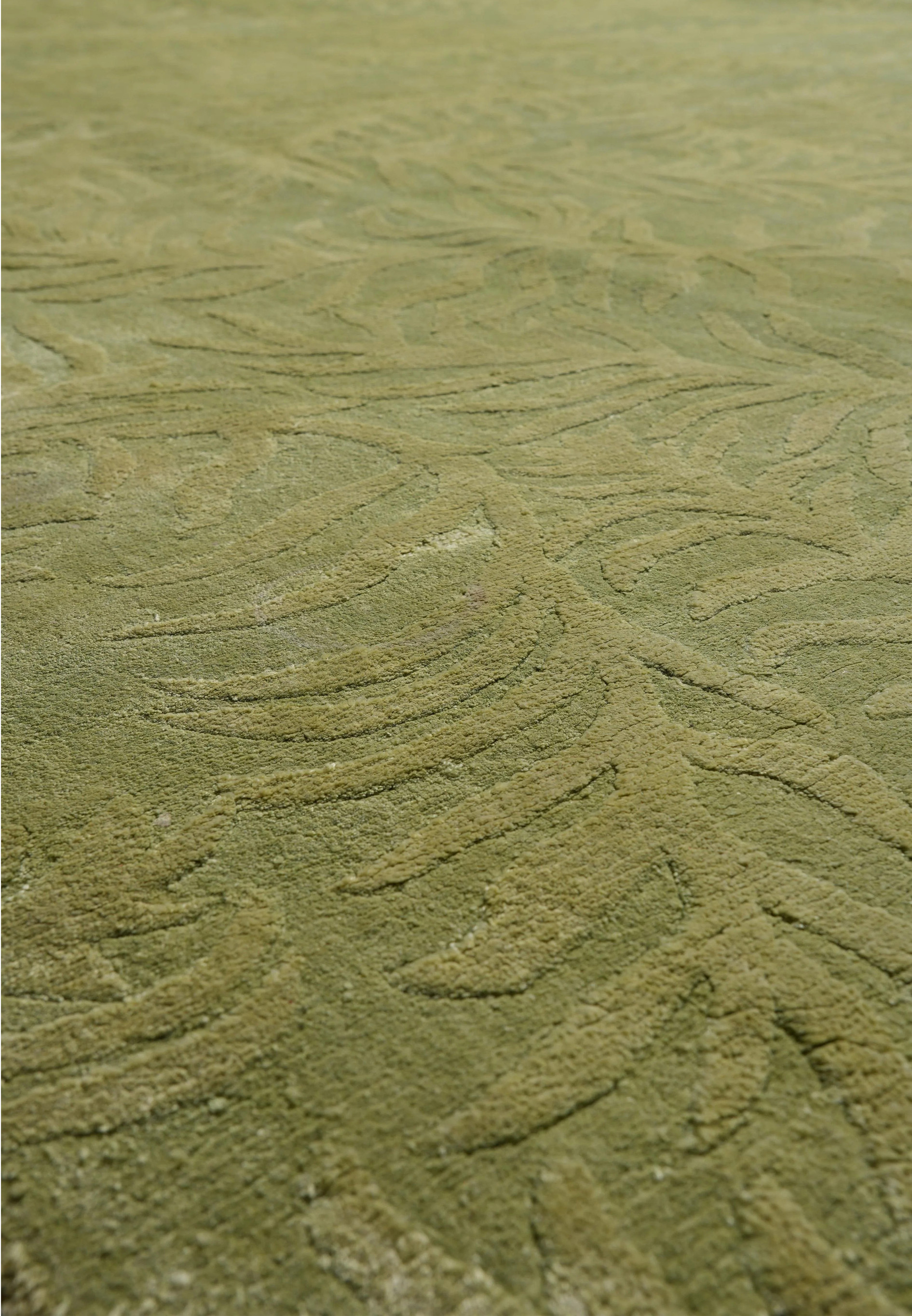 Close-up of the cotton foundation backing that supports the durable handmade construction of this modern rug.