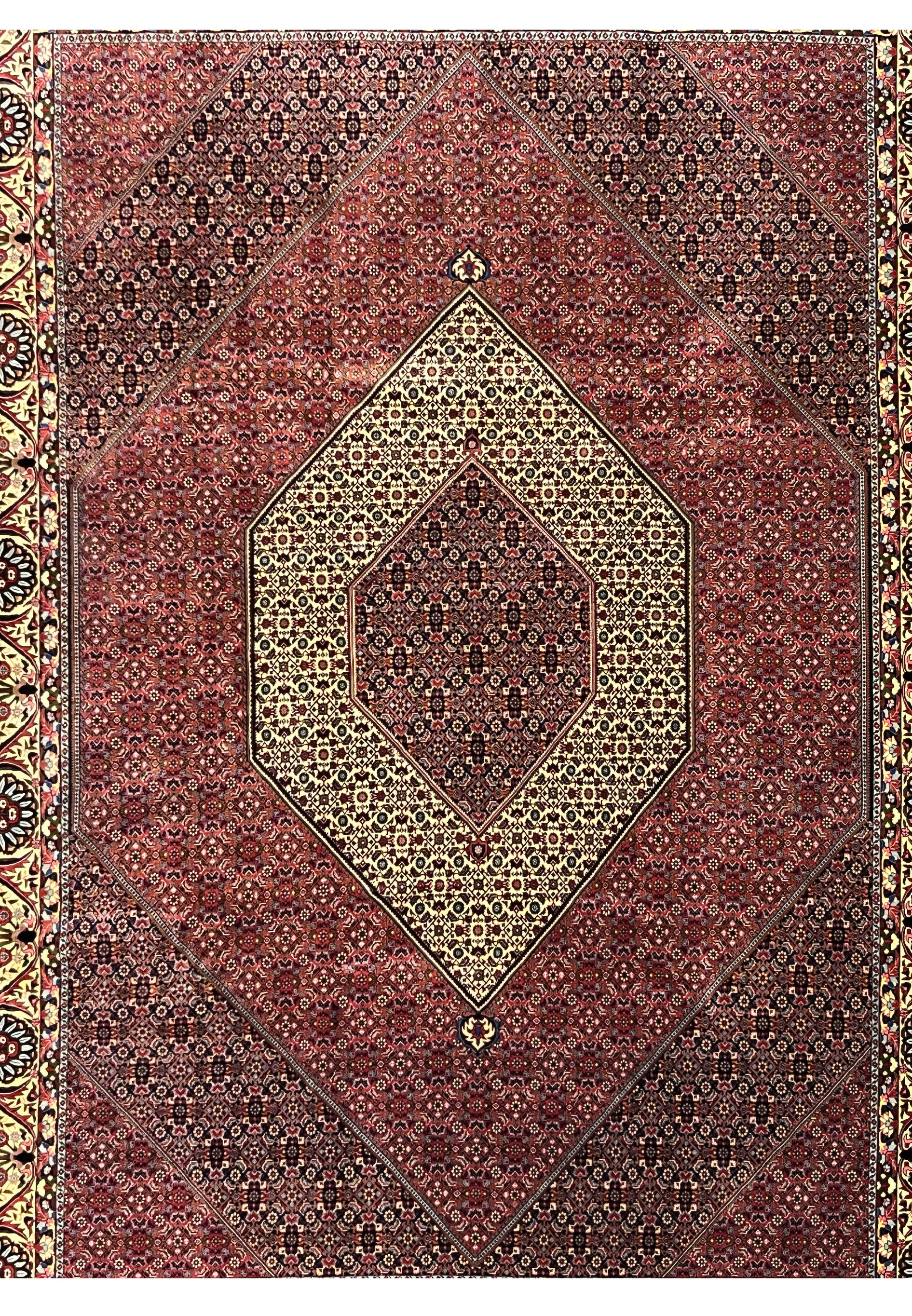 Midfield detail highlighting dense geometric motifs and tight knotting in a Persian Bijar iron rug