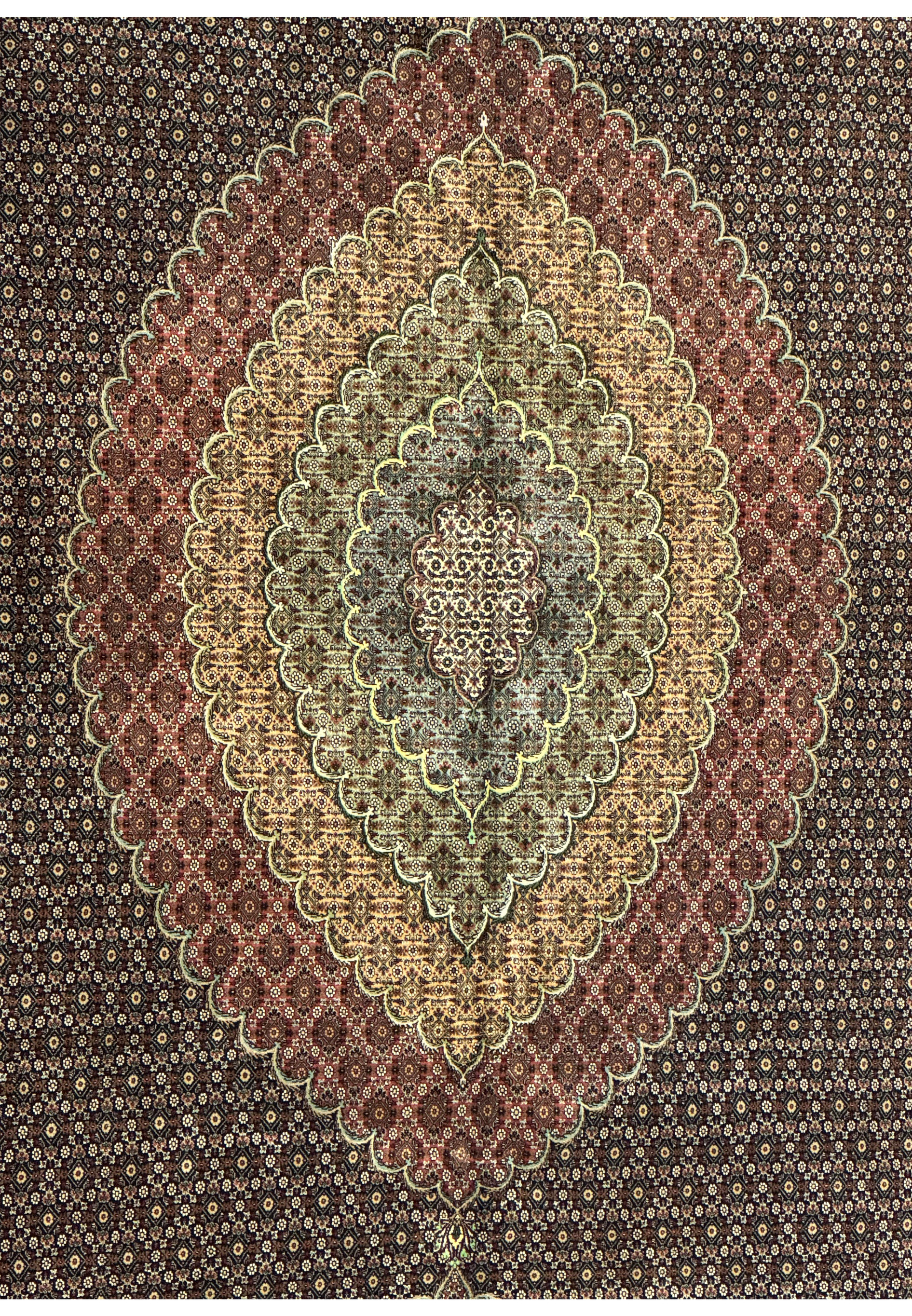 Close up of the central layered diamond medallion in a Persian Tabriz Mahi 50 Raj rug, revealing fine knot density and precise floral geometry