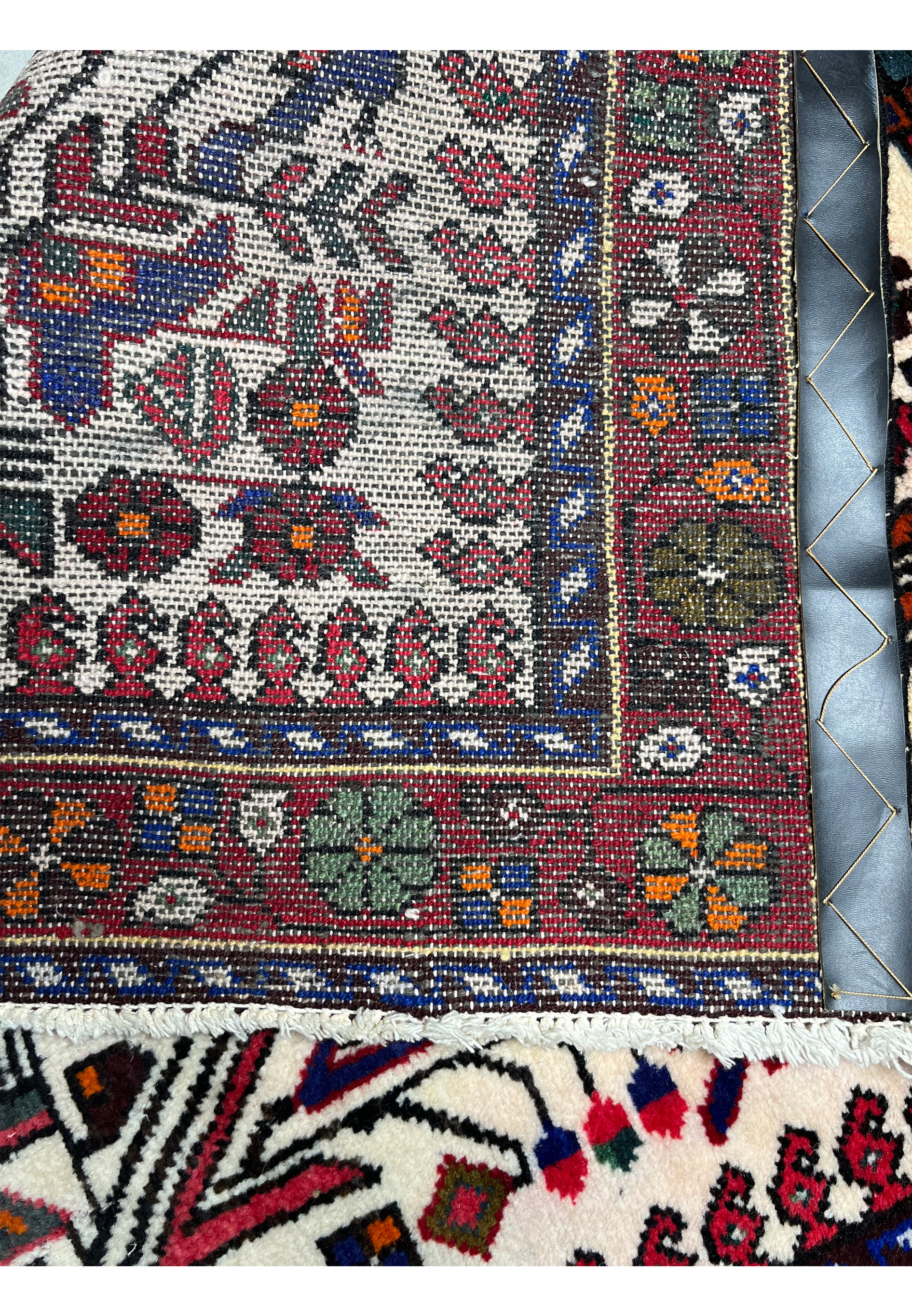 Complete backside view of Persian Rudbar village rug showing uniform knot density, strong wool foundation, and traditional handwoven construction.