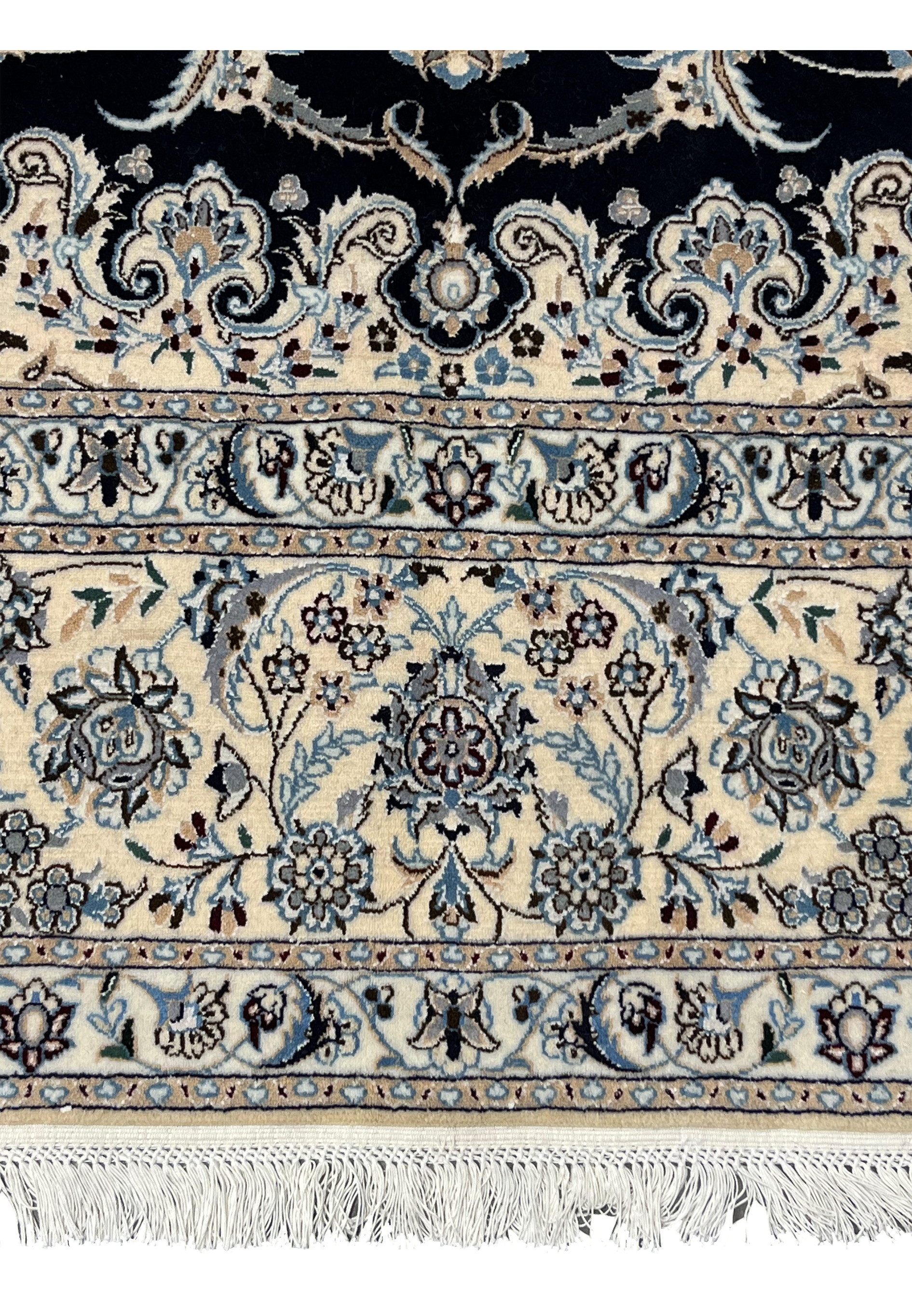 Lower border closeup of Persian Nain 6 LA silk rug with layered floral bands, ivory ground, and precise Habibian workshop detailing