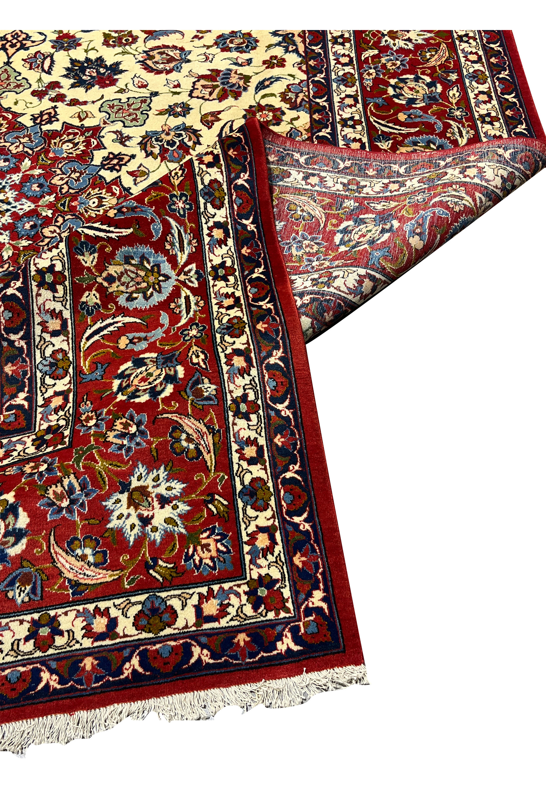 Folded corner view of a Persian Isfahan rug revealing clear pattern continuity, refined border work, and excellent material quality