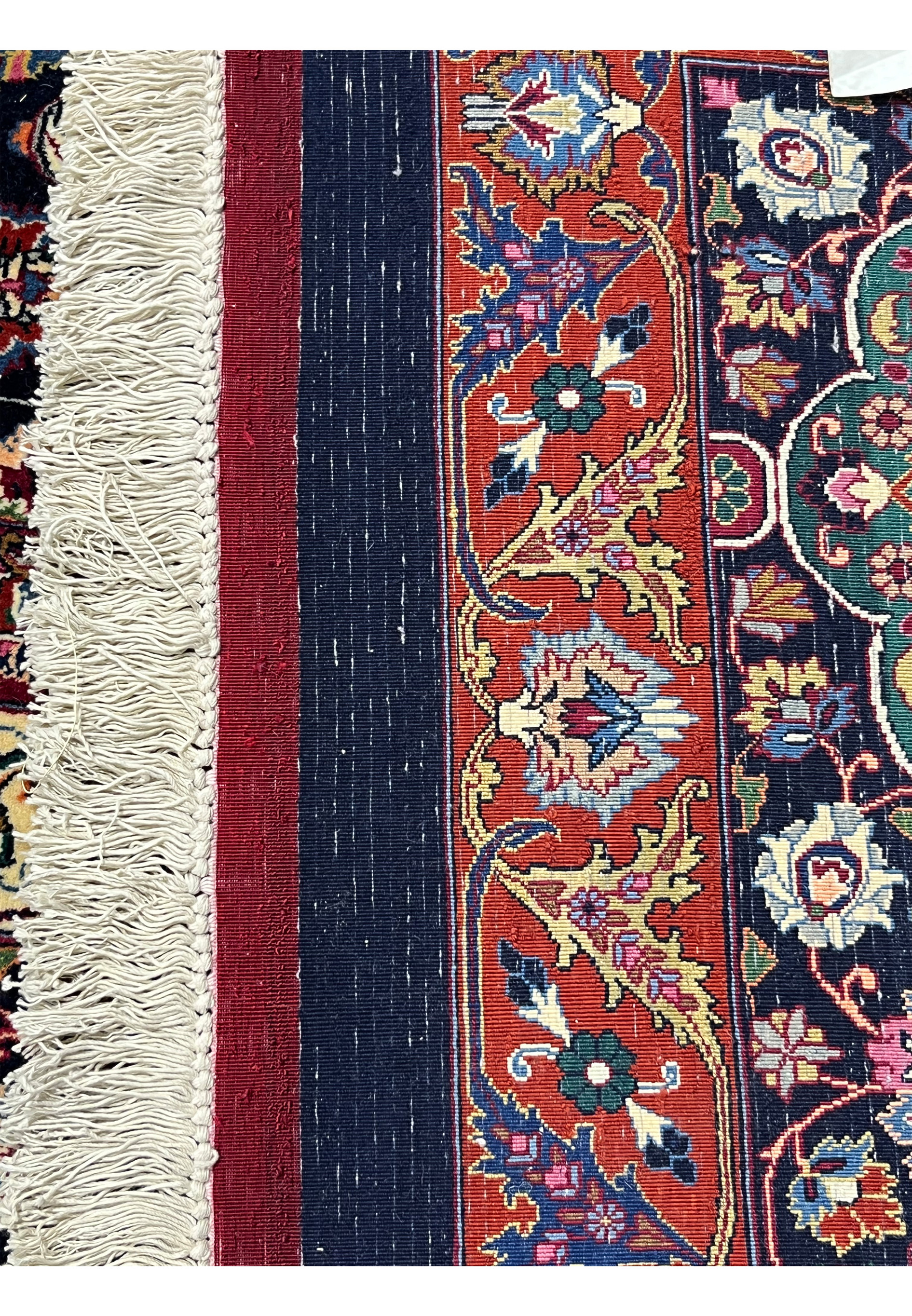 Backside view of a hand-knotted Persian Mashad rug revealing dense knot structure, precise craftsmanship, and the high-quality kork wool foundation.