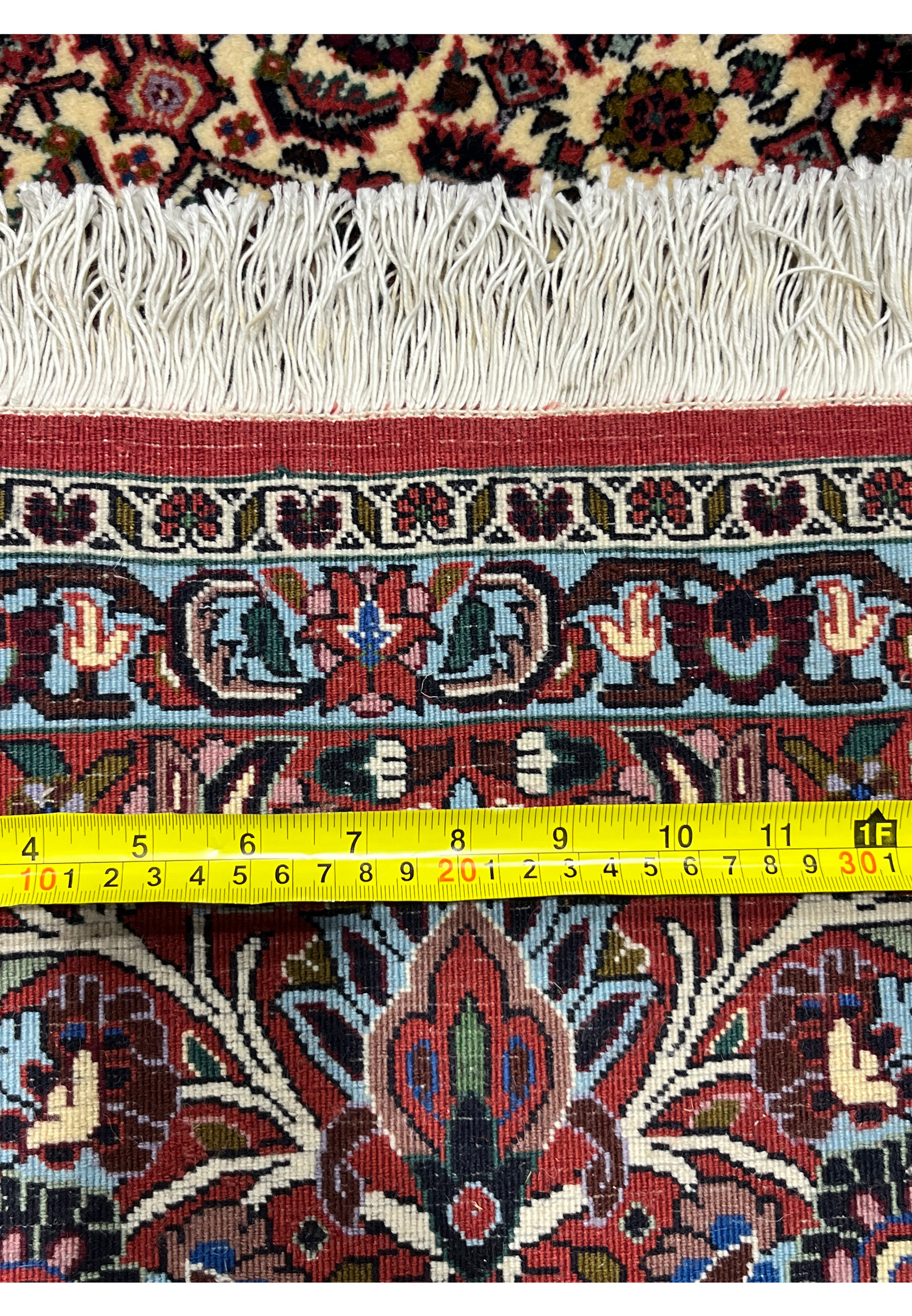 Close-up of the backside of a Persian Bijar rug revealing compact knots, heavy wool construction, and exceptional durability typical of iron rugs