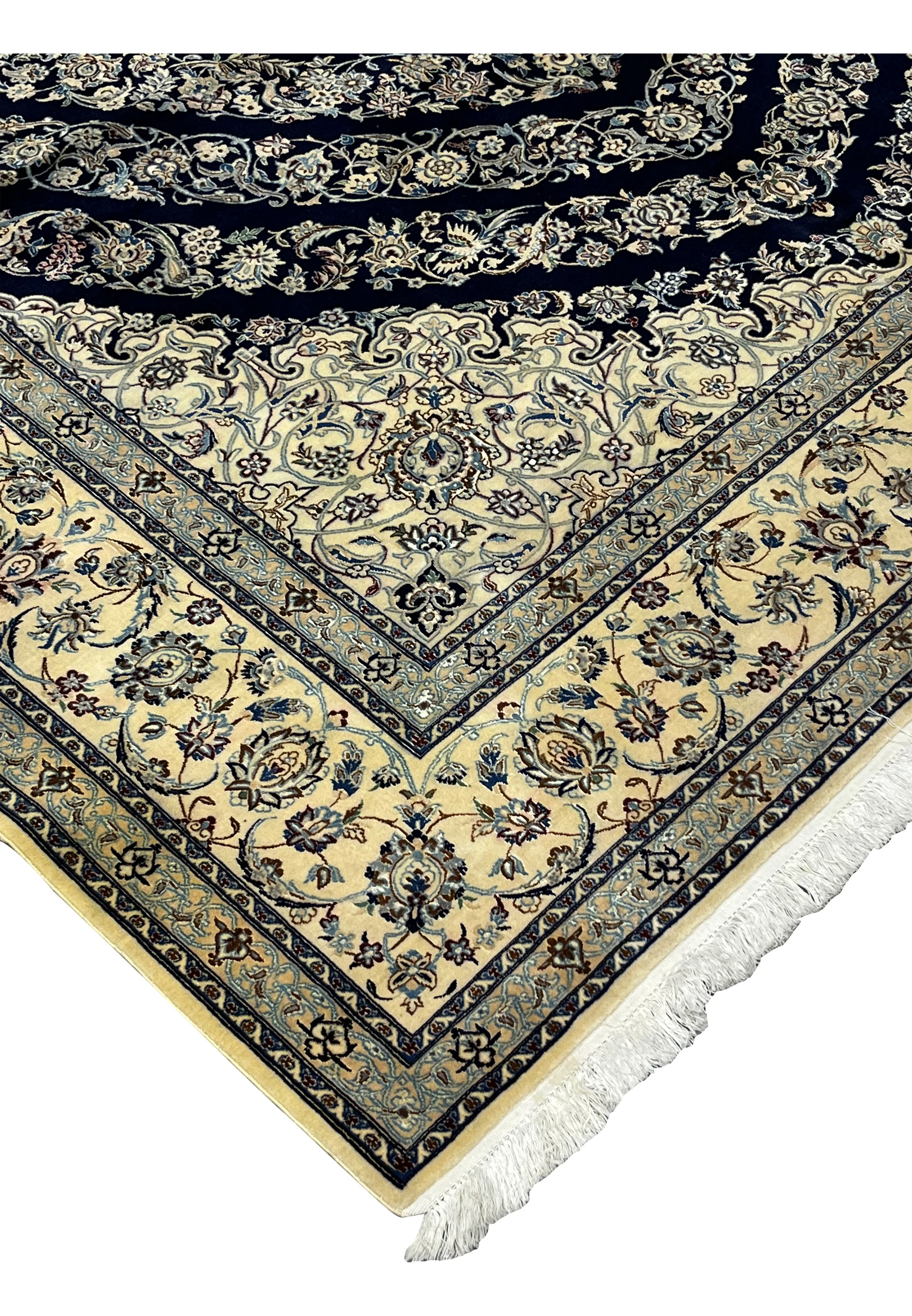 Edge detail of Persian Nain 6 La rug showing clean binding, fine knotting, and smooth silk foundation structure