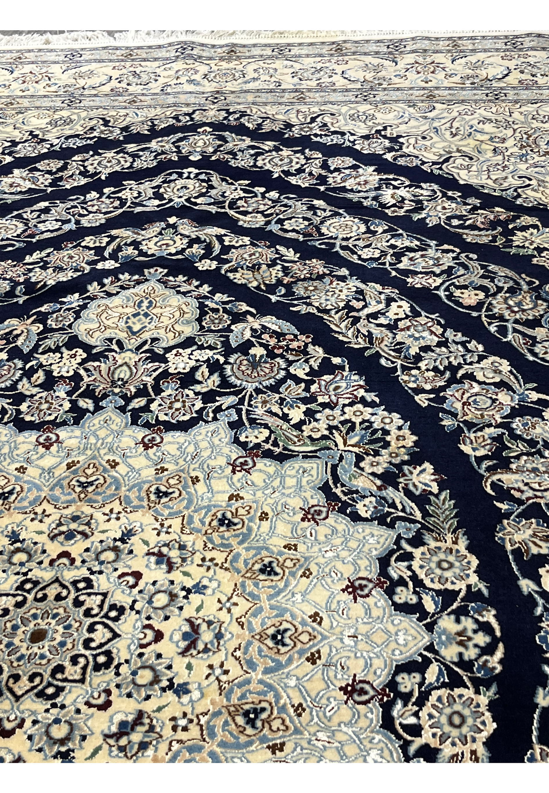 Front surface of a Persian Nain 6 La rug showing dense knotting, silk highlights, and smooth kork wool texture