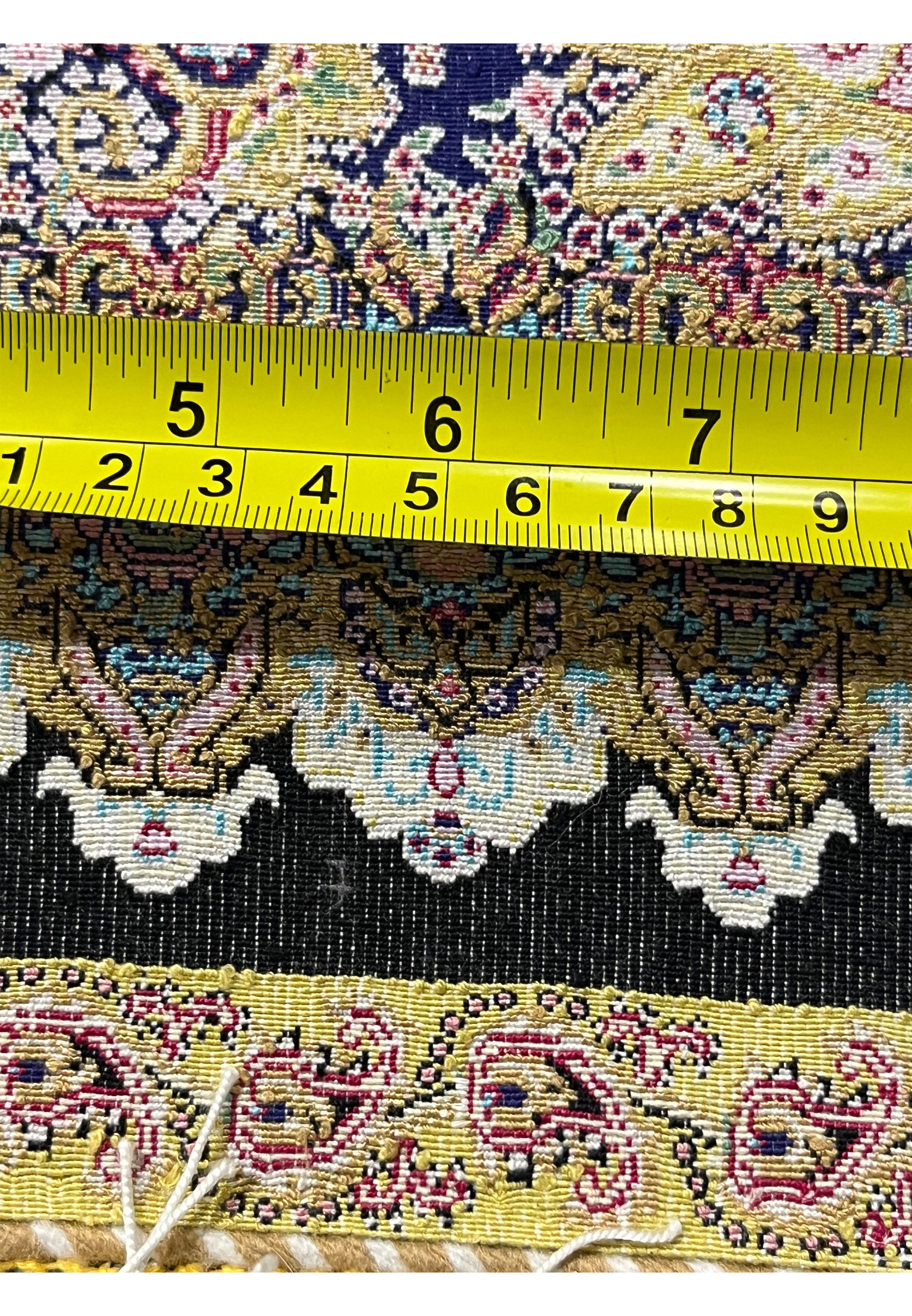 Measured backside view of a signed Persian Qum pure silk rug showing fine weave density and knot precision