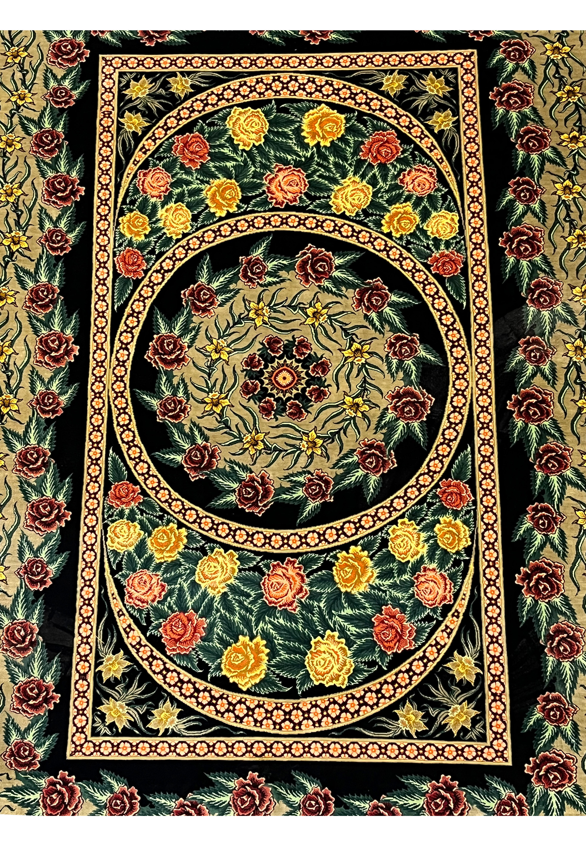 Midfield detail of a Persian Qum pure silk rug highlighting layered oval medallions, dense floral motifs, and sharp silk definition against a deep black ground