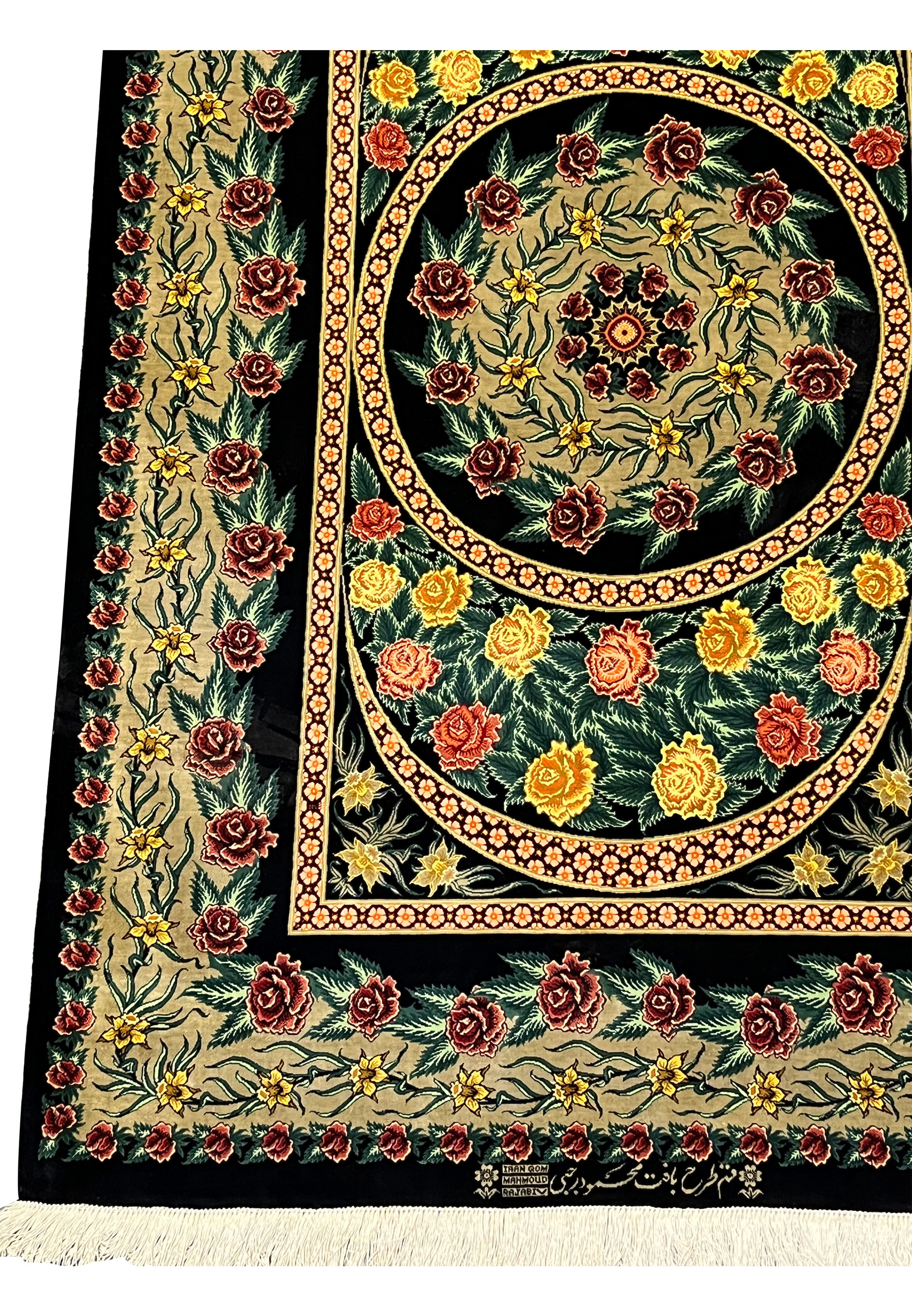 Border close-up of a Persian Qum 100 percent silk rug featuring repeating rose motifs, scrolling vines, and finely articulated floral guard borders