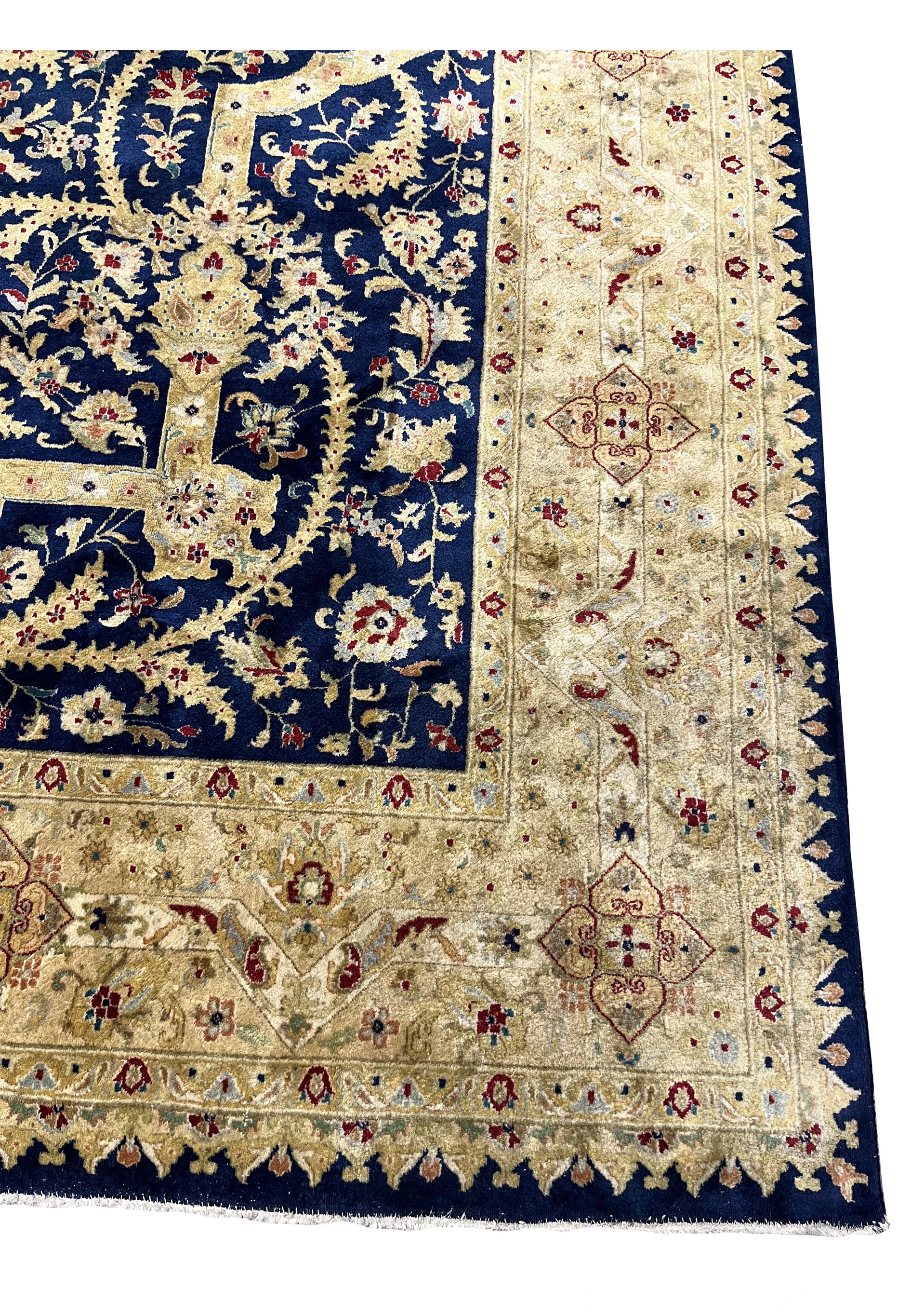 Detailed border view of an Oriental Agra rug with repeating floral patterns, aged gold palette, subtle repairs, and consistent distress along the edges