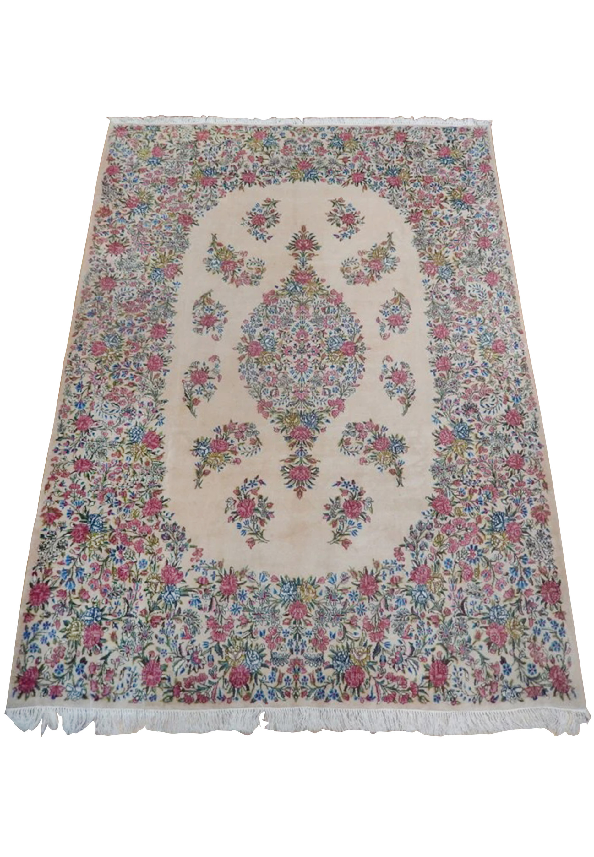 Full view of an 8' x 11'8 Persian Kerman floral rug with ivory field, central medallion, pink roses, blue blossoms, and dense botanical border