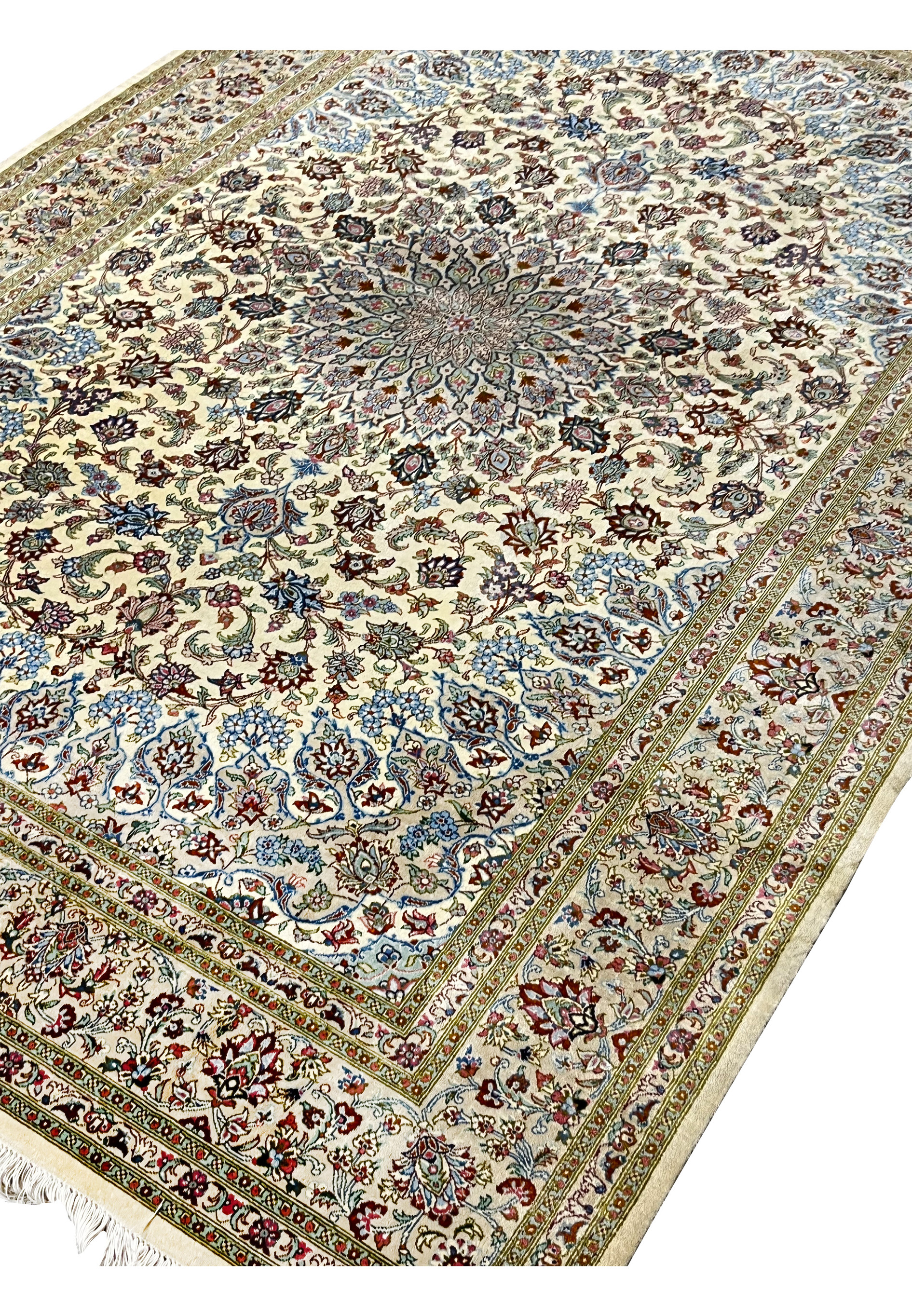 Angled perspective of a 4'5 x 6'7 signed Persian Qum silk rug highlighting dimensional depth, medallion symmetry, and the natural sheen of pure silk fibers.