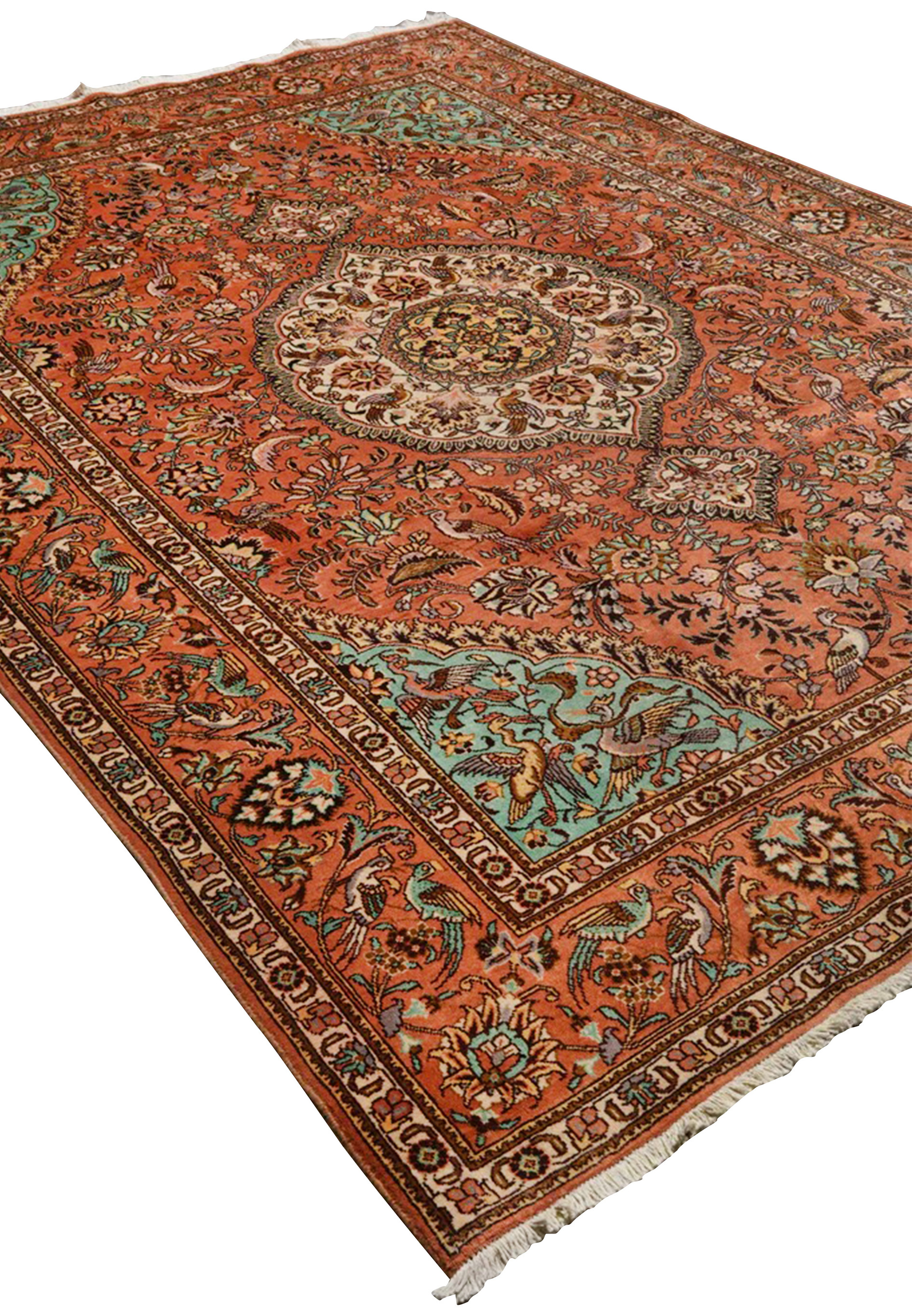 Angled perspective of a Paradies Persian Tabriz rug showcasing depth, bird-filled garden design, and luminous terracotta coloration