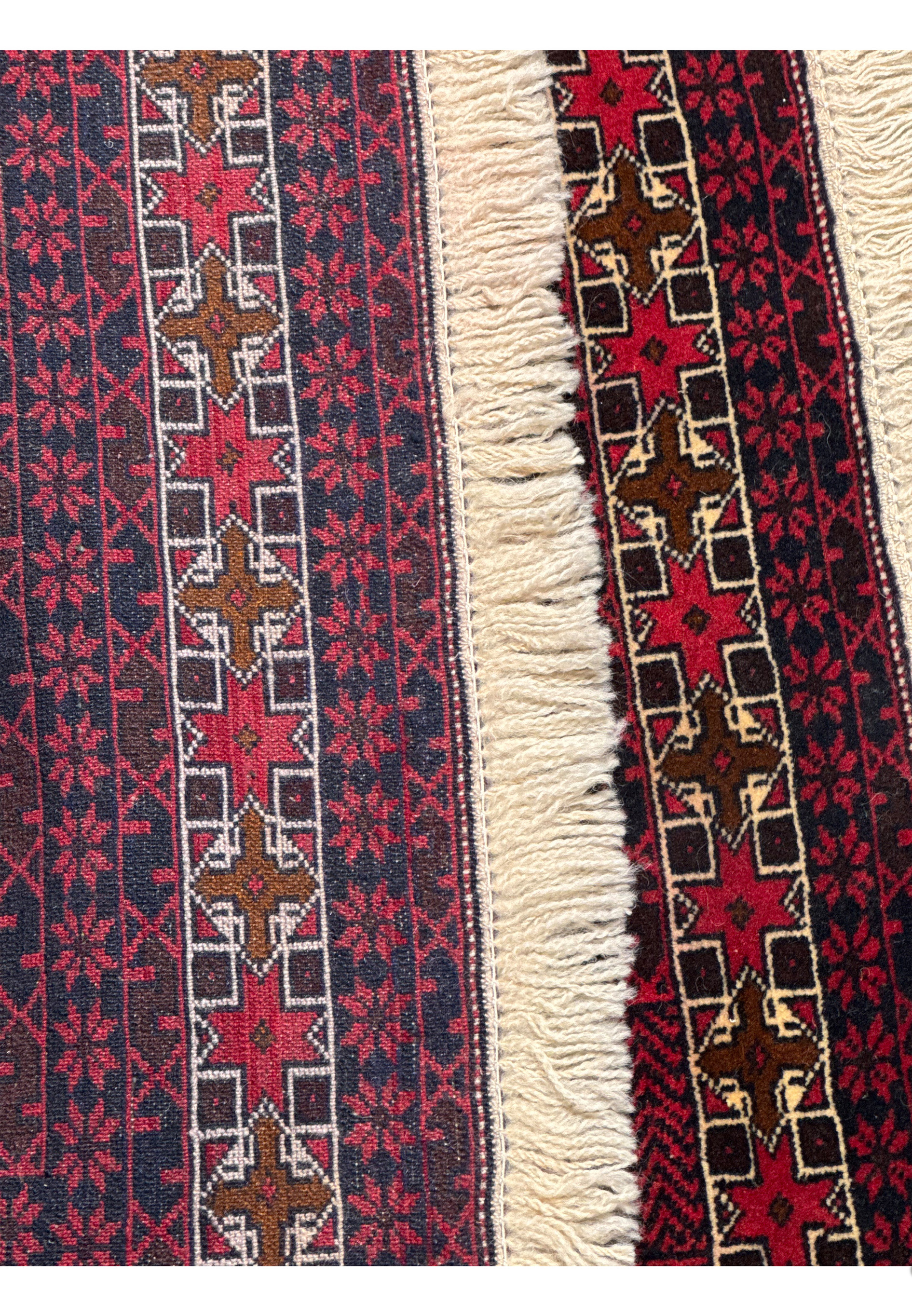 Backside view of a Persian Baluch prayer rug revealing tight knotting, clear pattern visibility, and strong tribal weaving technique