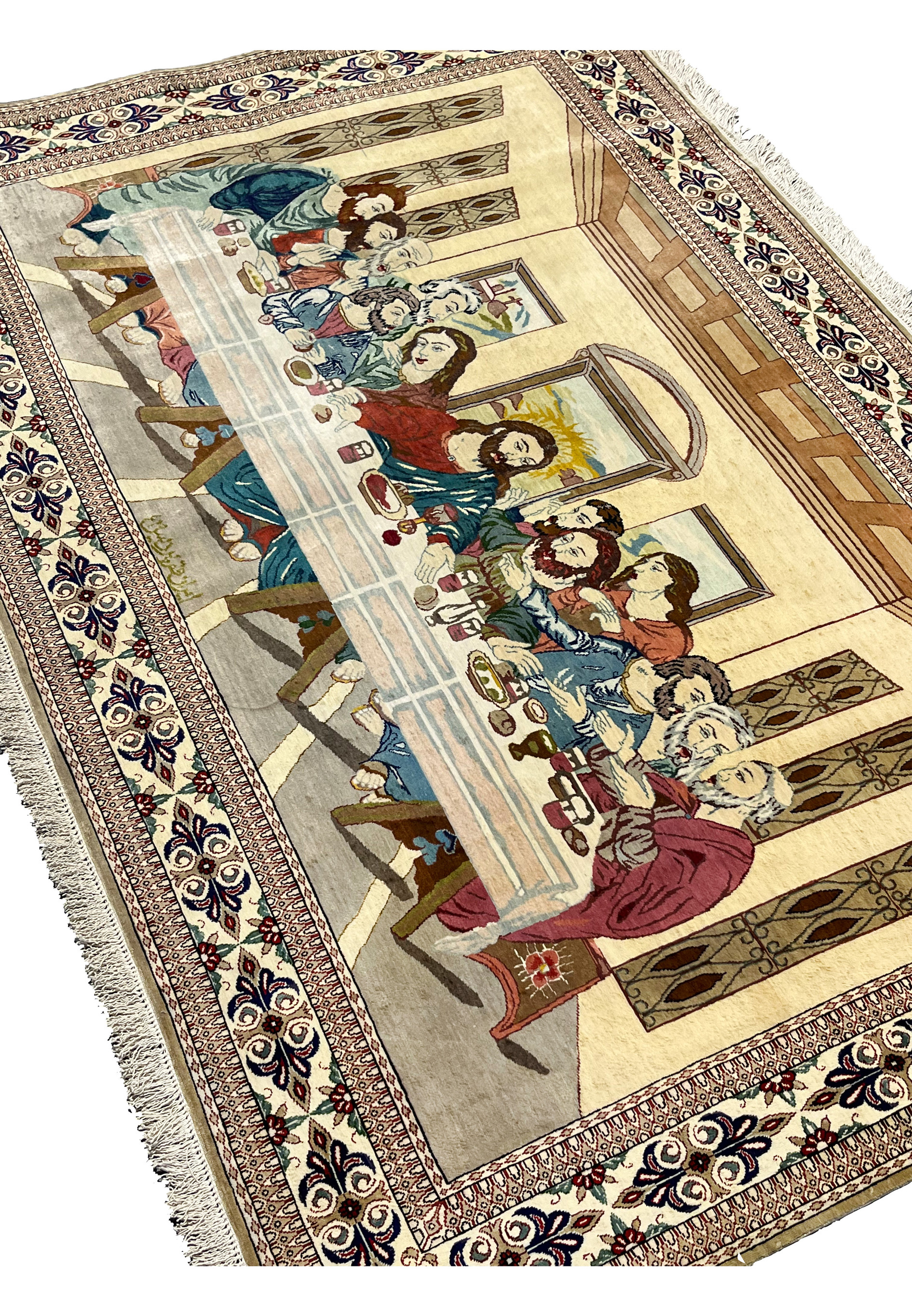 Angled view of signed pure silk Persian Qum Pardis Last Supper rug revealing sheen, depth of color, and fine pictorial weaving